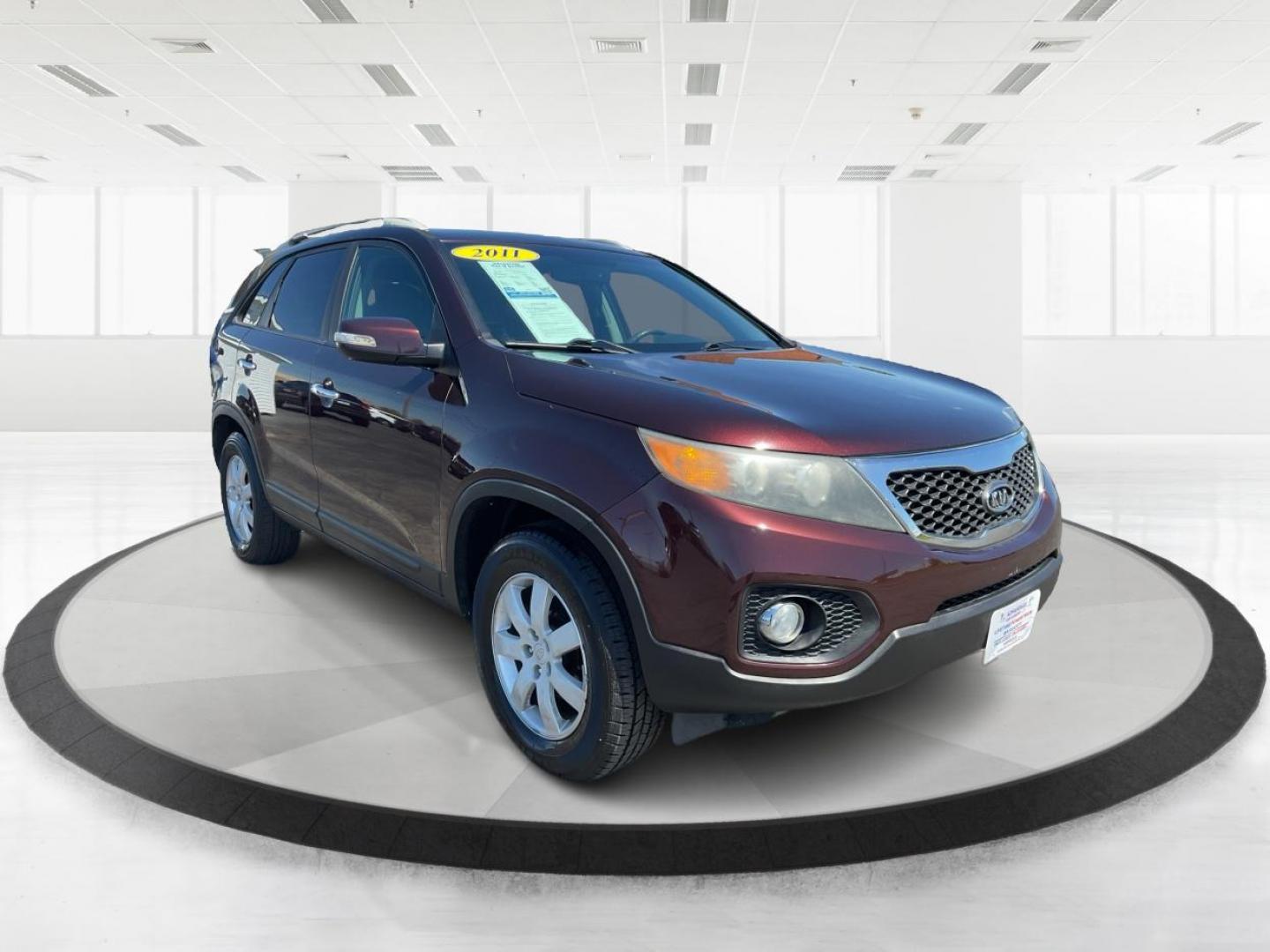 2011 Dark Cherry Kia Sorento LX 2WD (5XYKT3A14BG) with an 2.4L L4 DOHC 16V engine, 6-Speed Automatic transmission, located at 1184 Kauffman Ave, Fairborn, OH, 45324, (937) 908-9800, 39.807072, -84.030914 - 2011 Kia Sorento LX 2WD - Photo#0