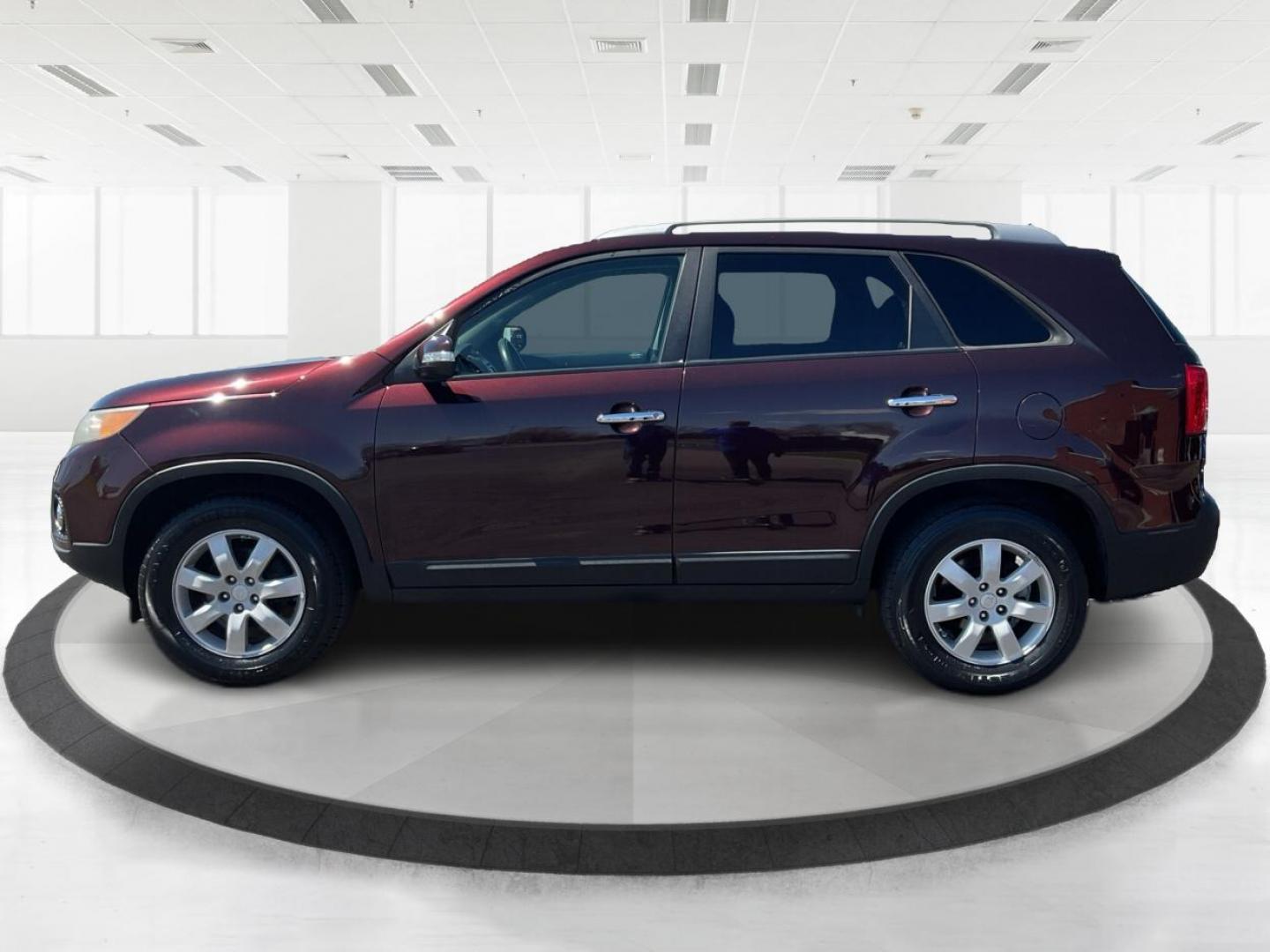 2011 Dark Cherry Kia Sorento LX 2WD (5XYKT3A14BG) with an 2.4L L4 DOHC 16V engine, 6-Speed Automatic transmission, located at 1184 Kauffman Ave, Fairborn, OH, 45324, (937) 908-9800, 39.807072, -84.030914 - 2011 Kia Sorento LX 2WD - Photo#5