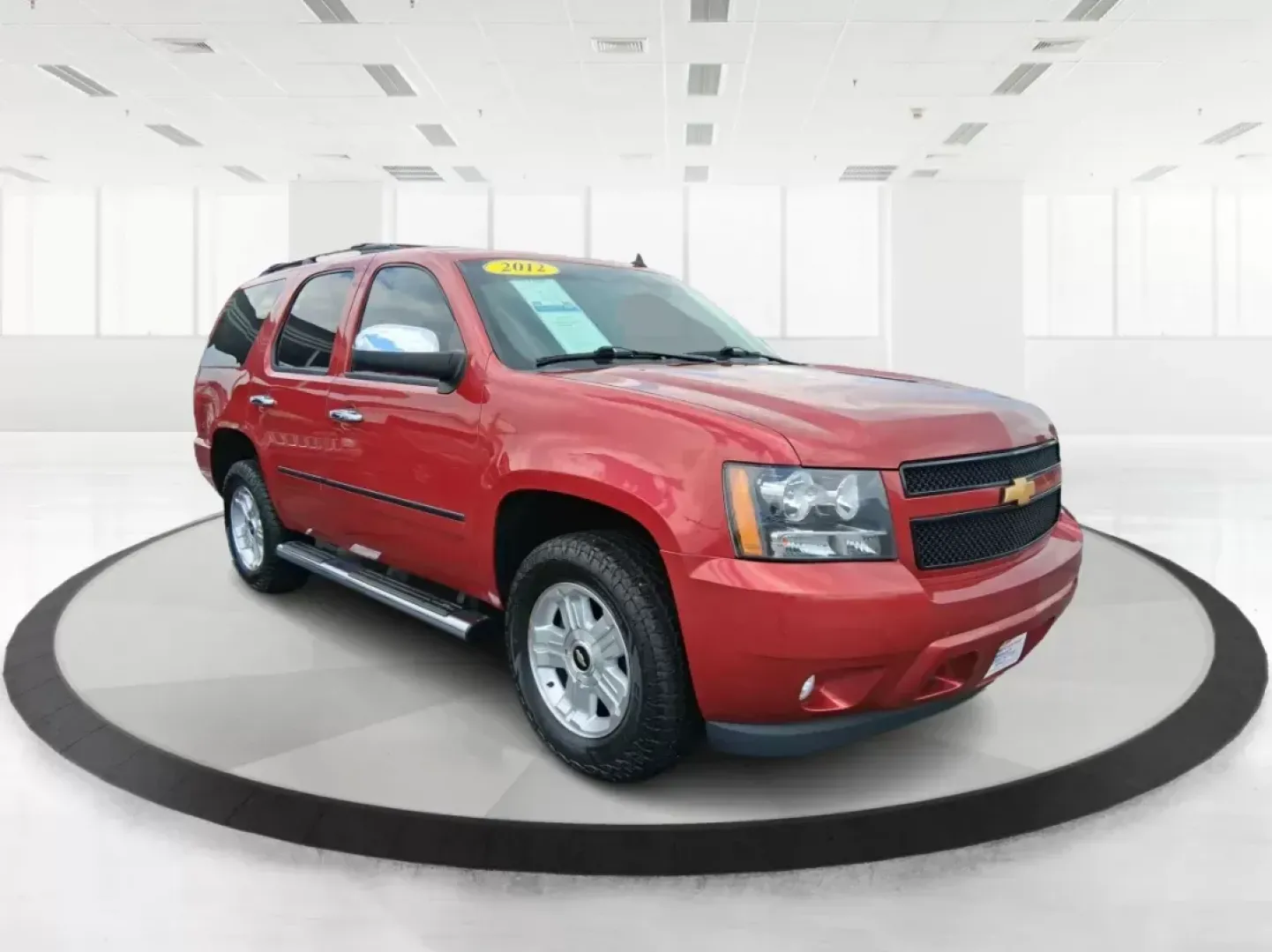 2012 Chevrolet Tahoe LTZ (1GNSKCE09CR) with an Vortec 5.3L V-8 variable valve control engine, located at 8750 N County Rd 25A, Piqua, OH, 45356, (937) 908-9800, 40.164391, -84.232513 - Experience the ultimate in family adventures with the 2012 Chevrolet Tahoe LTZ, available at Advantage Car and Credit in Fairborn, OH. This striking Crystal Red Tintcoat utility vehicle is the perfect blend of power, luxury, and versatility, making it an ideal choice for growing families and weekend - Photo#0