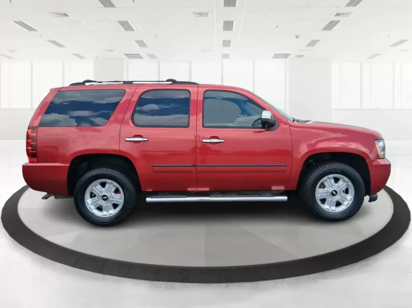 2012 Chevrolet Tahoe LTZ (1GNSKCE09CR) with an Vortec 5.3L V-8 variable valve control engine, located at 8750 N County Rd 25A, Piqua, OH, 45356, (937) 908-9800, 40.164391, -84.232513 - Experience the ultimate in family adventures with the 2012 Chevrolet Tahoe LTZ, available at Advantage Car and Credit in Fairborn, OH. This striking Crystal Red Tintcoat utility vehicle is the perfect blend of power, luxury, and versatility, making it an ideal choice for growing families and weekend - Photo#1