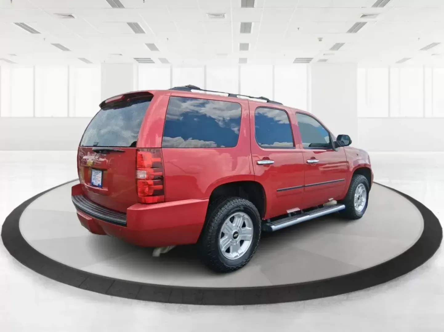 2012 Chevrolet Tahoe LTZ (1GNSKCE09CR) with an Vortec 5.3L V-8 variable valve control engine, located at 8750 N County Rd 25A, Piqua, OH, 45356, (937) 908-9800, 40.164391, -84.232513 - Experience the ultimate in family adventures with the 2012 Chevrolet Tahoe LTZ, available at Advantage Car and Credit in Fairborn, OH. This striking Crystal Red Tintcoat utility vehicle is the perfect blend of power, luxury, and versatility, making it an ideal choice for growing families and weekend - Photo#2
