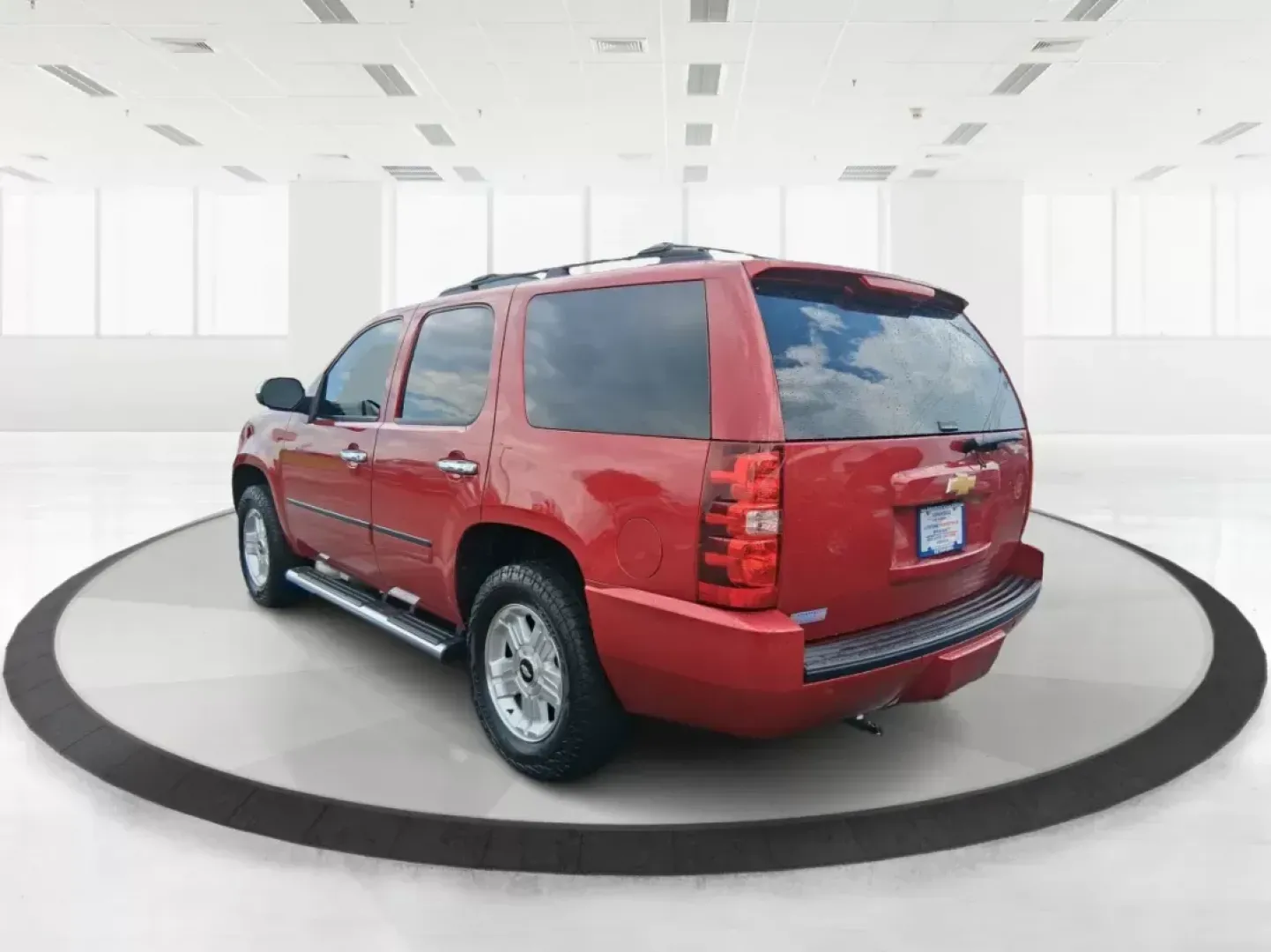 2012 Chevrolet Tahoe LTZ (1GNSKCE09CR) with an Vortec 5.3L V-8 variable valve control engine, located at 8750 N County Rd 25A, Piqua, OH, 45356, (937) 908-9800, 40.164391, -84.232513 - Experience the ultimate in family adventures with the 2012 Chevrolet Tahoe LTZ, available at Advantage Car and Credit in Fairborn, OH. This striking Crystal Red Tintcoat utility vehicle is the perfect blend of power, luxury, and versatility, making it an ideal choice for growing families and weekend - Photo#4