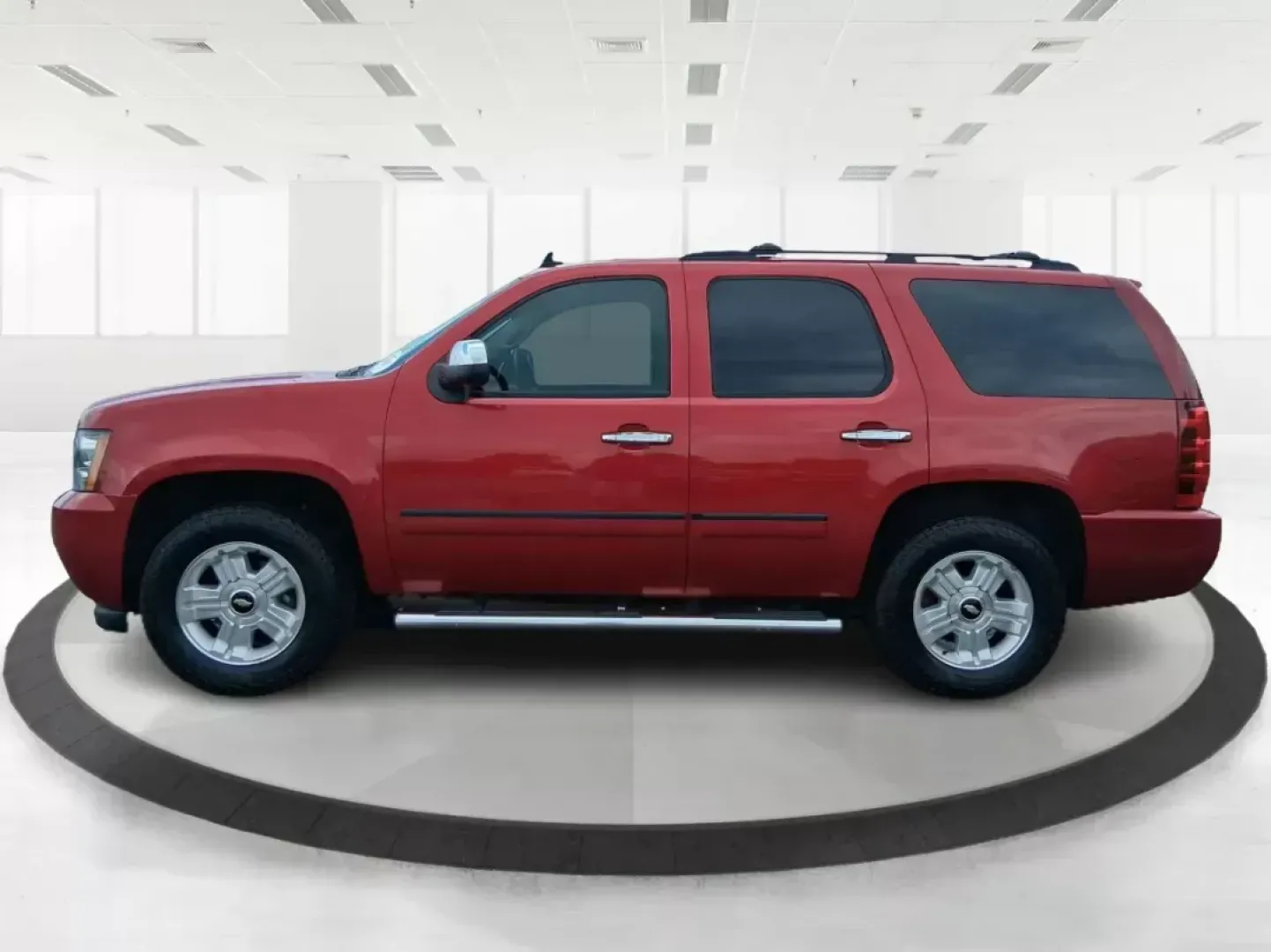 2012 Chevrolet Tahoe LTZ (1GNSKCE09CR) with an Vortec 5.3L V-8 variable valve control engine, located at 8750 N County Rd 25A, Piqua, OH, 45356, (937) 908-9800, 40.164391, -84.232513 - Experience the ultimate in family adventures with the 2012 Chevrolet Tahoe LTZ, available at Advantage Car and Credit in Fairborn, OH. This striking Crystal Red Tintcoat utility vehicle is the perfect blend of power, luxury, and versatility, making it an ideal choice for growing families and weekend - Photo#5