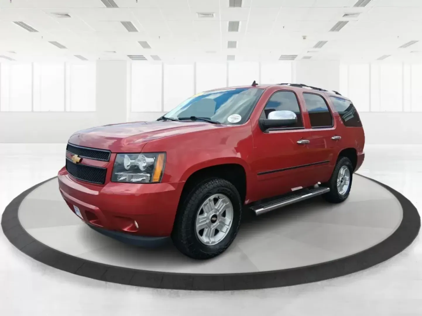 2012 Chevrolet Tahoe LTZ (1GNSKCE09CR) with an Vortec 5.3L V-8 variable valve control engine, located at 8750 N County Rd 25A, Piqua, OH, 45356, (937) 908-9800, 40.164391, -84.232513 - Experience the ultimate in family adventures with the 2012 Chevrolet Tahoe LTZ, available at Advantage Car and Credit in Fairborn, OH. This striking Crystal Red Tintcoat utility vehicle is the perfect blend of power, luxury, and versatility, making it an ideal choice for growing families and weekend - Photo#7