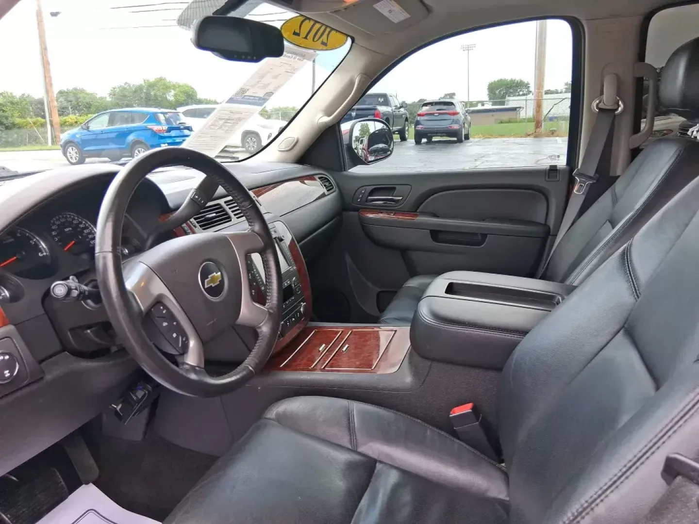 2012 Chevrolet Tahoe LTZ (1GNSKCE09CR) with an Vortec 5.3L V-8 variable valve control engine, located at 8750 N County Rd 25A, Piqua, OH, 45356, (937) 908-9800, 40.164391, -84.232513 - Experience the ultimate in family adventures with the 2012 Chevrolet Tahoe LTZ, available at Advantage Car and Credit in Fairborn, OH. This striking Crystal Red Tintcoat utility vehicle is the perfect blend of power, luxury, and versatility, making it an ideal choice for growing families and weekend - Photo#8