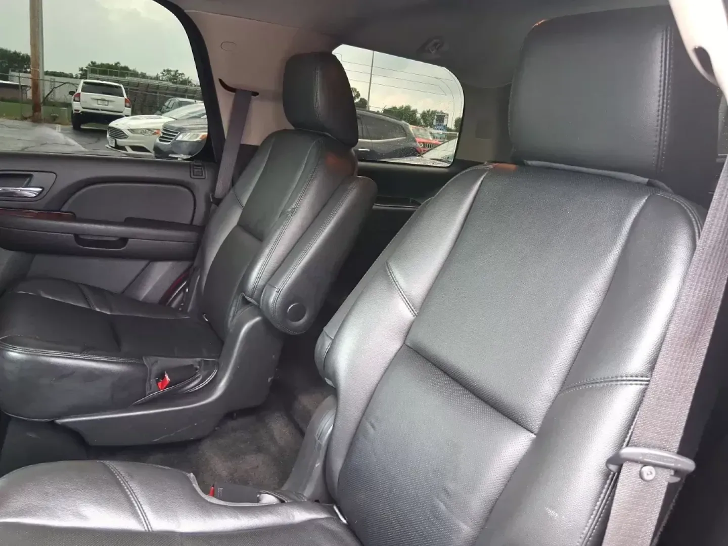 2012 Chevrolet Tahoe LTZ (1GNSKCE09CR) with an Vortec 5.3L V-8 variable valve control engine, located at 8750 N County Rd 25A, Piqua, OH, 45356, (937) 908-9800, 40.164391, -84.232513 - Experience the ultimate in family adventures with the 2012 Chevrolet Tahoe LTZ, available at Advantage Car and Credit in Fairborn, OH. This striking Crystal Red Tintcoat utility vehicle is the perfect blend of power, luxury, and versatility, making it an ideal choice for growing families and weekend - Photo#9