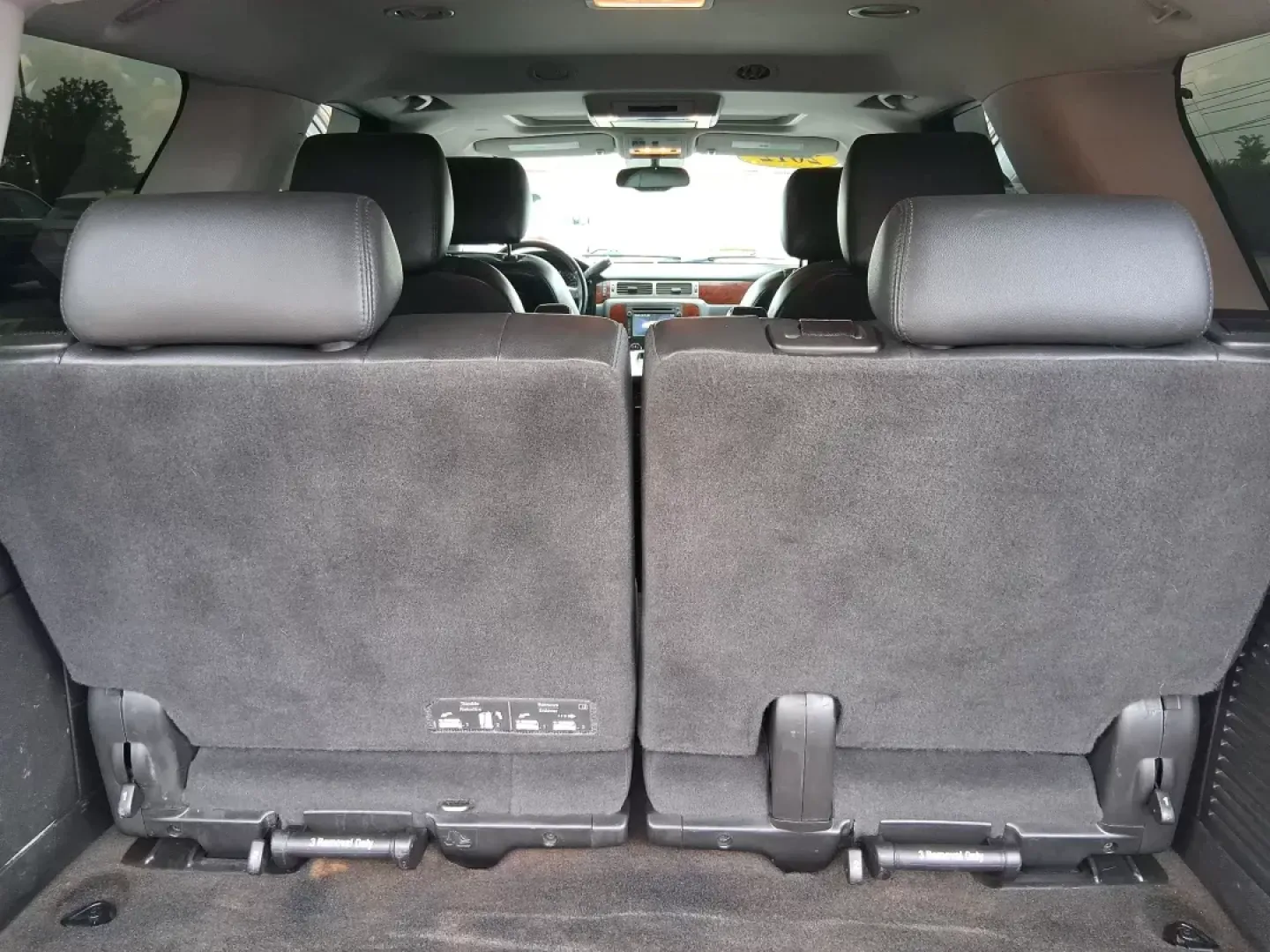 2012 Chevrolet Tahoe LTZ (1GNSKCE09CR) with an Vortec 5.3L V-8 variable valve control engine, located at 8750 N County Rd 25A, Piqua, OH, 45356, (937) 908-9800, 40.164391, -84.232513 - Experience the ultimate in family adventures with the 2012 Chevrolet Tahoe LTZ, available at Advantage Car and Credit in Fairborn, OH. This striking Crystal Red Tintcoat utility vehicle is the perfect blend of power, luxury, and versatility, making it an ideal choice for growing families and weekend - Photo#11