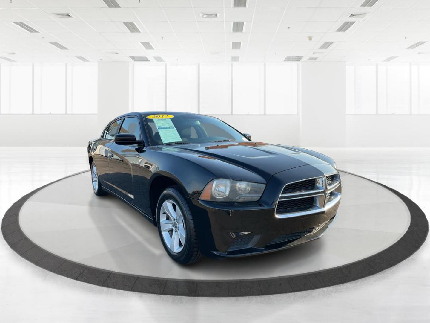 2012 Pitch Black Dodge Charger SE (2C3CDXBGXCH) with an 3.6L V6 DOHC 24V engine, 5-Speed Automatic transmission, located at 401 Woodman Dr, Riverside, OH, 45431, (937) 908-9800, 39.760899, -84.123421 - 2012 Dodge Charger SE - Photo#0