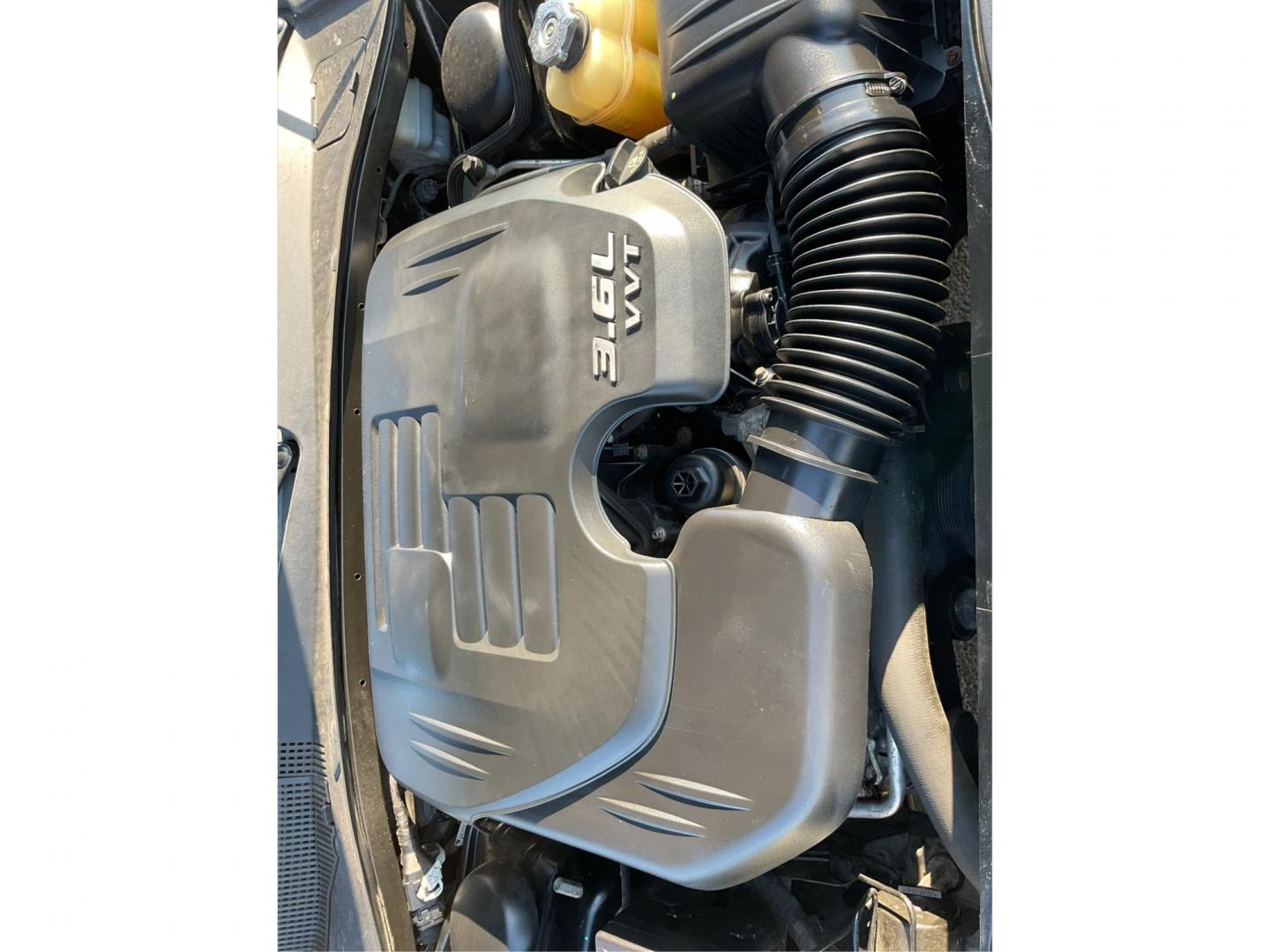 2012 Pitch Black Dodge Charger SE (2C3CDXBGXCH) with an 3.6L V6 DOHC 24V engine, 5-Speed Automatic transmission, located at 401 Woodman Dr, Riverside, OH, 45431, (937) 908-9800, 39.760899, -84.123421 - 2012 Dodge Charger SE - Photo#10