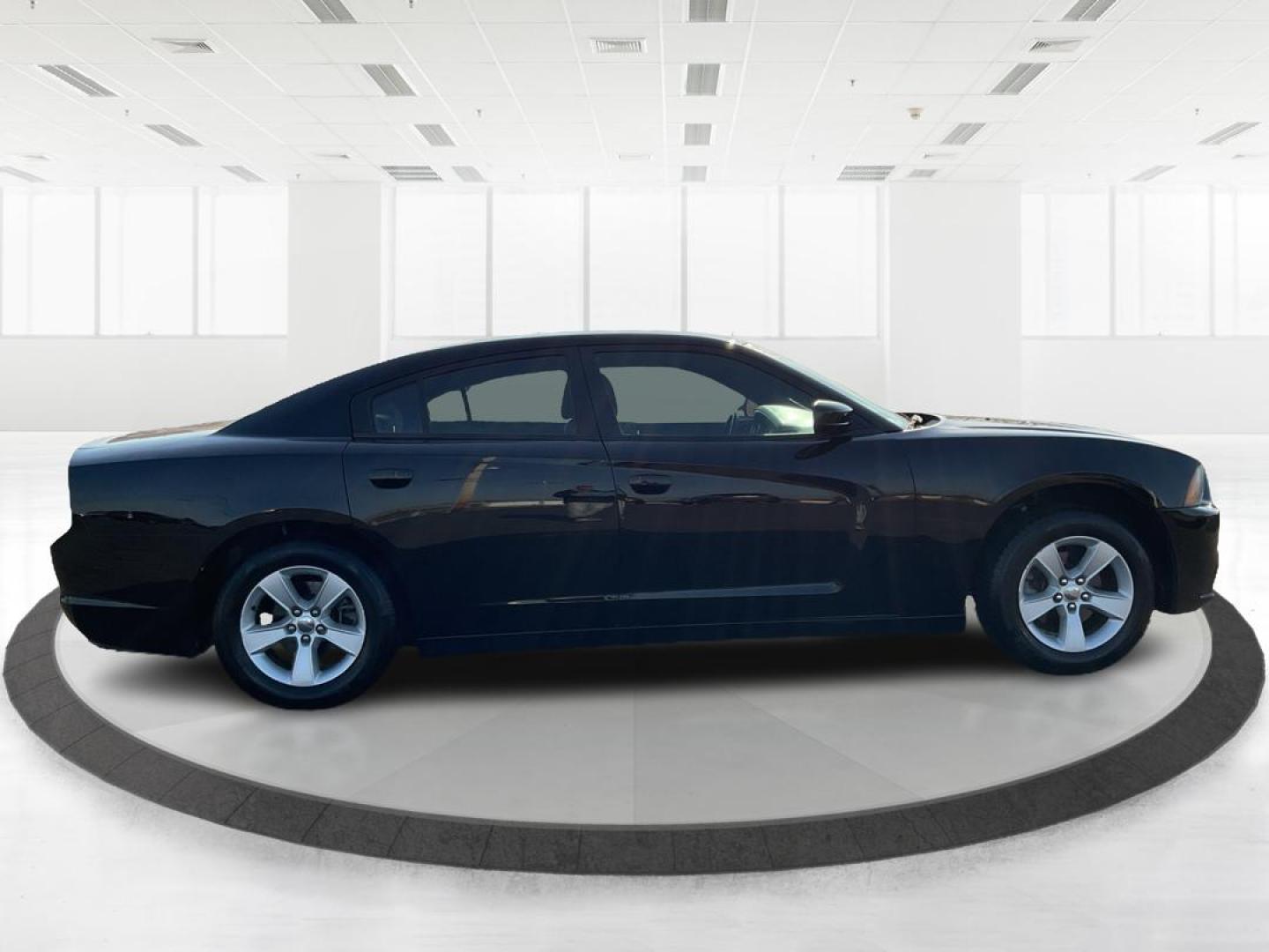 2012 Pitch Black Dodge Charger SE (2C3CDXBGXCH) with an 3.6L V6 DOHC 24V engine, 5-Speed Automatic transmission, located at 401 Woodman Dr, Riverside, OH, 45431, (937) 908-9800, 39.760899, -84.123421 - 2012 Dodge Charger SE - Photo#1