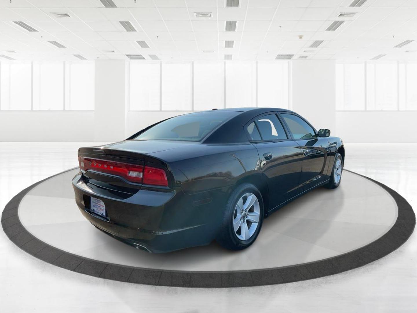 2012 Pitch Black Dodge Charger SE (2C3CDXBGXCH) with an 3.6L V6 DOHC 24V engine, 5-Speed Automatic transmission, located at 401 Woodman Dr, Riverside, OH, 45431, (937) 908-9800, 39.760899, -84.123421 - 2012 Dodge Charger SE - Photo#2