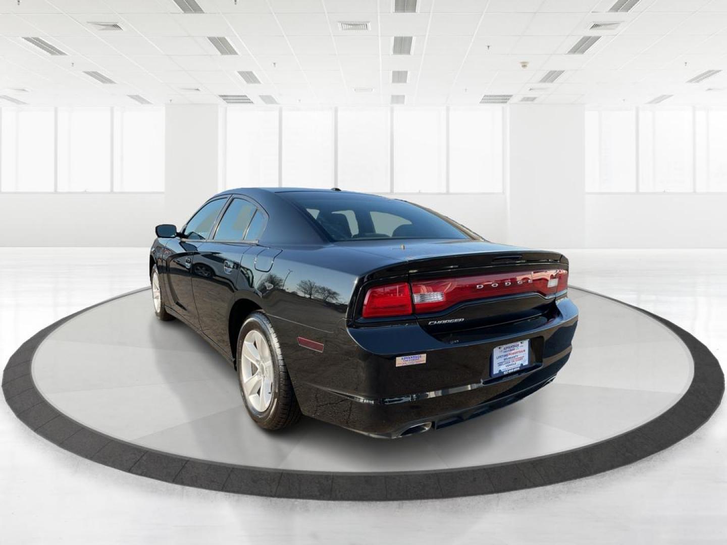 2012 Pitch Black Dodge Charger SE (2C3CDXBGXCH) with an 3.6L V6 DOHC 24V engine, 5-Speed Automatic transmission, located at 401 Woodman Dr, Riverside, OH, 45431, (937) 908-9800, 39.760899, -84.123421 - 2012 Dodge Charger SE - Photo#4