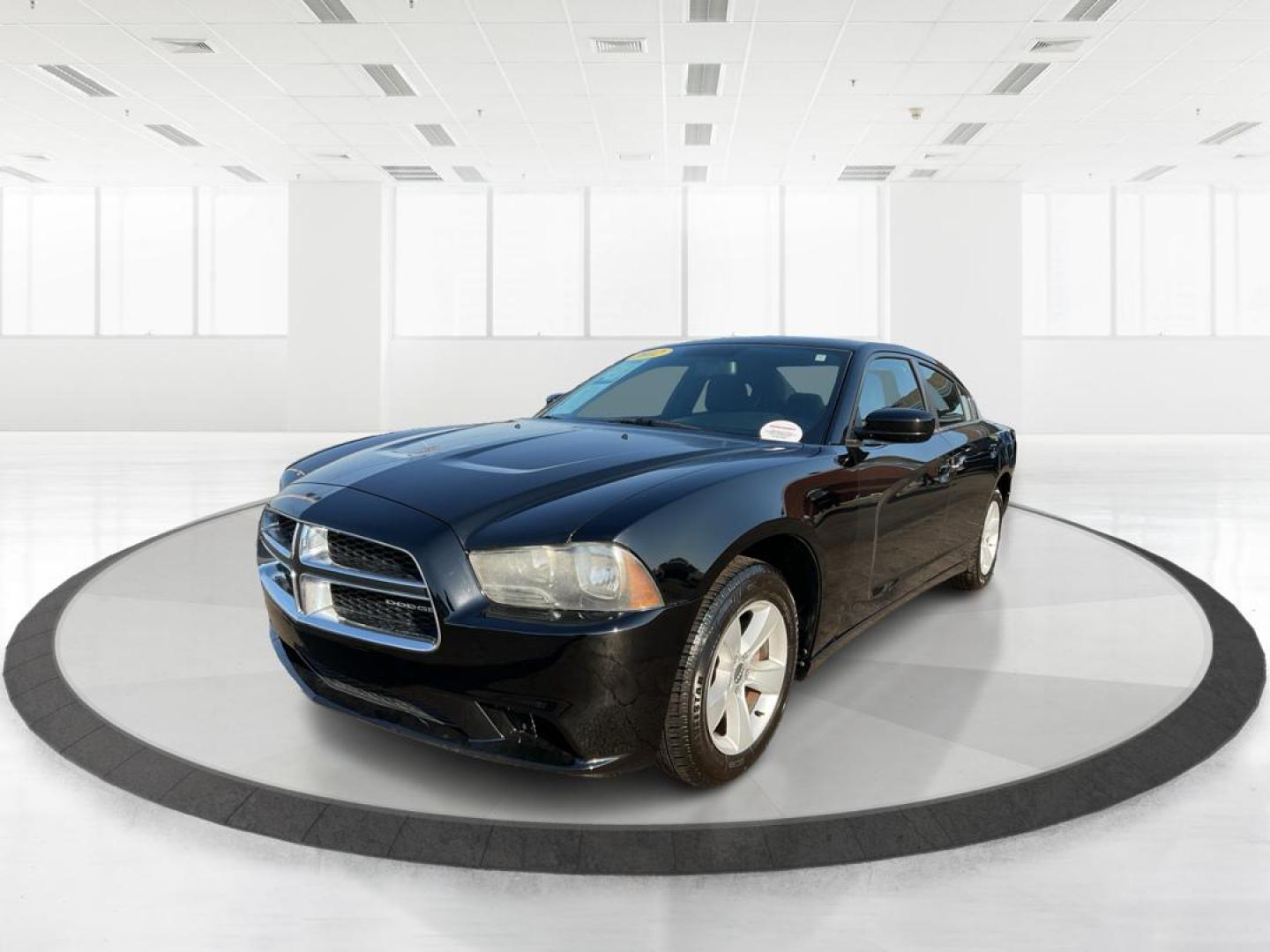 2012 Pitch Black Dodge Charger SE (2C3CDXBGXCH) with an 3.6L V6 DOHC 24V engine, 5-Speed Automatic transmission, located at 401 Woodman Dr, Riverside, OH, 45431, (937) 908-9800, 39.760899, -84.123421 - 2012 Dodge Charger SE - Photo#7
