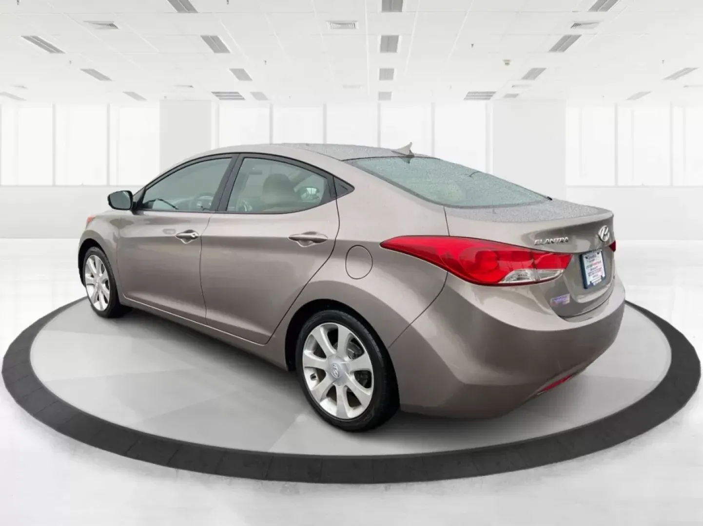 2012 Hyundai Elantra Limited (5NPDH4AE8CH) with an 1.8L I-4 DOHC engine, located at 401 Woodman Dr, Riverside, OH, 45431, (937) 908-9800, 39.760899, -84.123421 - 2012 Hyundai Elantra Limited - Photo#4