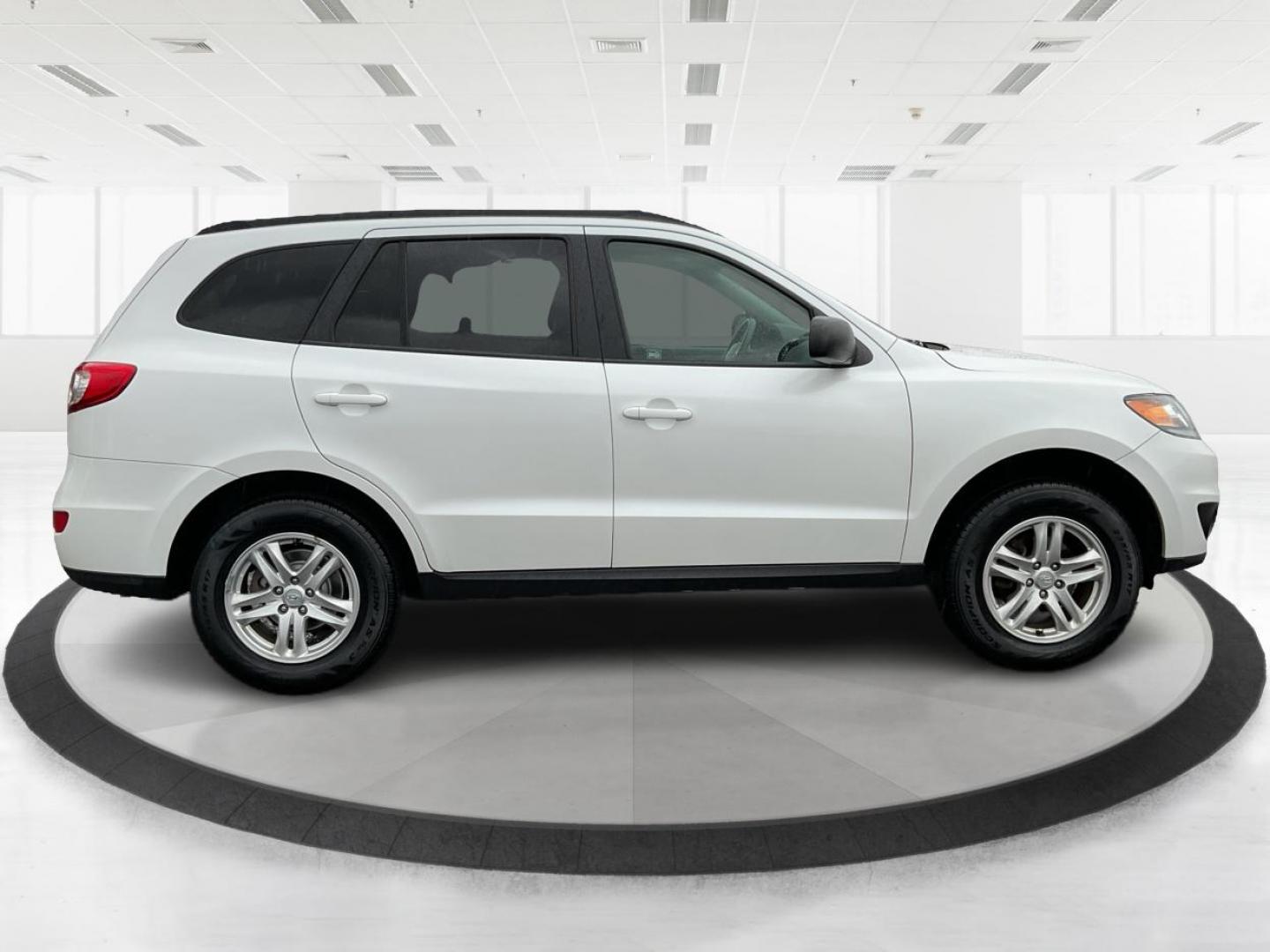 2012 Hyundai Santa Fe GLS (5XYZGDAB5CG) with an 2.4L I-4 DOHC engine, located at 1099 N County Rd 25A, Troy, OH, 45373, (937) 908-9800, 40.057079, -84.212883 - One Owner - Photo#1
