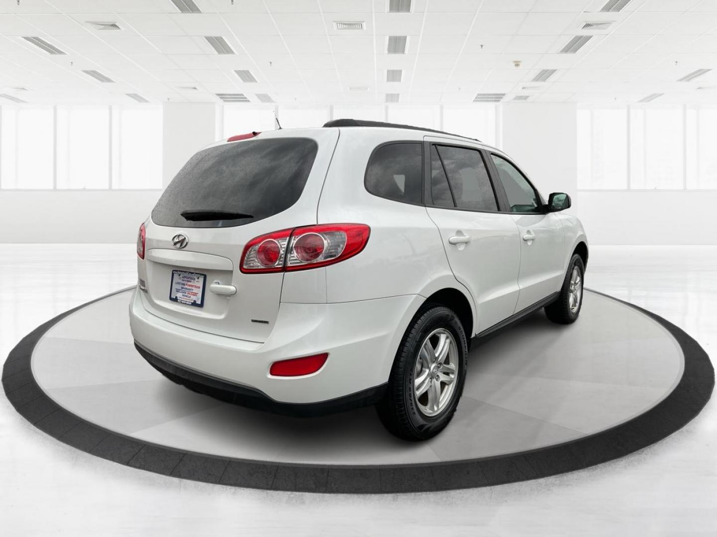 2012 Hyundai Santa Fe GLS (5XYZGDAB5CG) with an 2.4L I-4 DOHC engine, located at 1099 N County Rd 25A, Troy, OH, 45373, (937) 908-9800, 40.057079, -84.212883 - One Owner - Photo#2