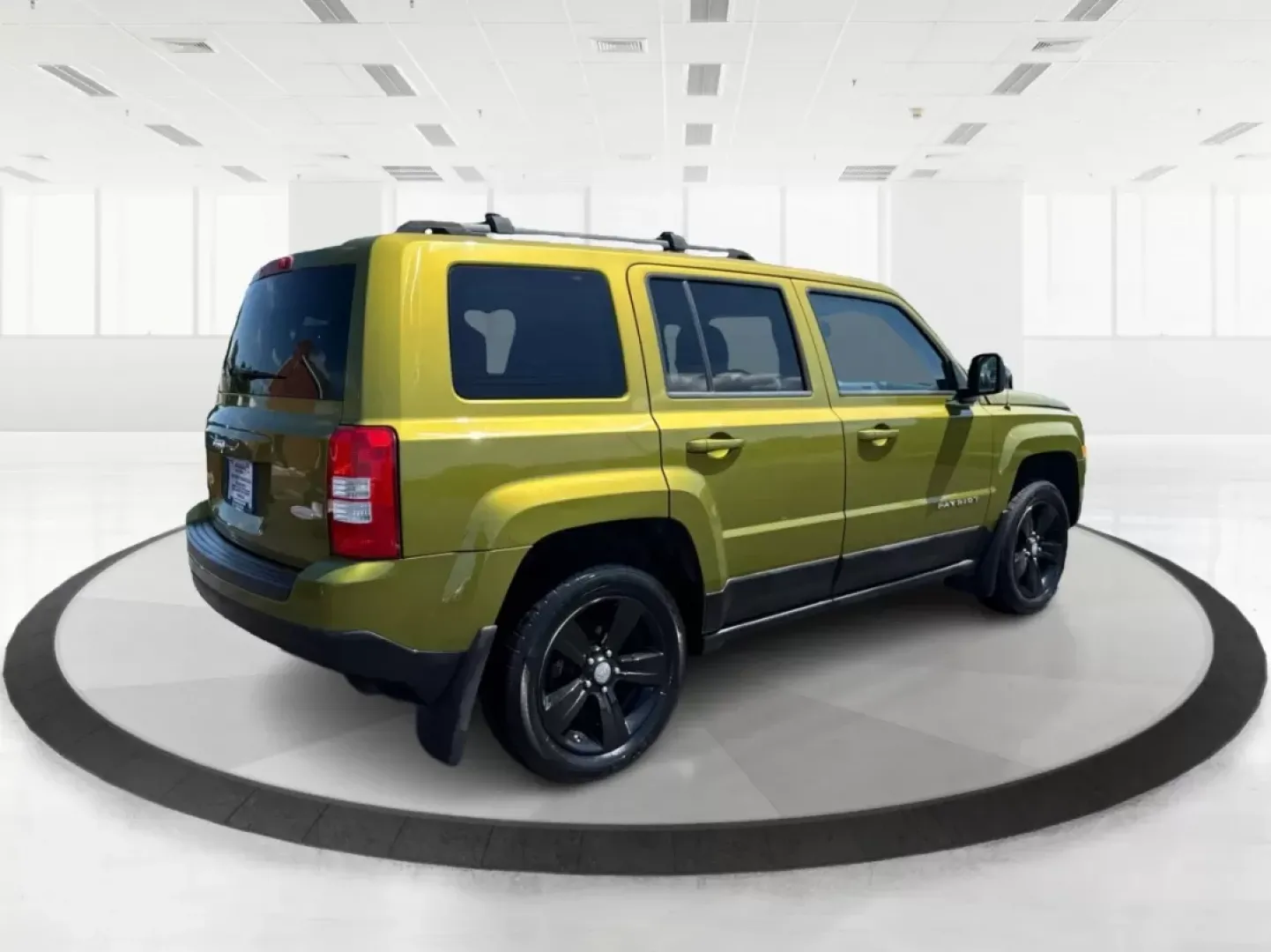 2012 Rescue Green Metallic Jeep Patriot Latitude 4WD (1C4NJRFB8CD) with an 2.4L L4 DOHC 16V engine, located at 1951 S Dayton Lakeview Rd., New Carlisle, OH, 45344, (937) 908-9800, 39.890999, -84.050255 - **Discover Your Next Adventure with the 2012 Jeep Patriot Latitude 4WD at Advantage Car and Credit!**<br /> <br /> Are you ready to elevate your weekend getaways and everyday commutes? The 2012 Jeep Patriot Latitude 4WD is the perfect companion for those who crave adventure and seek comfort in their - Photo#2