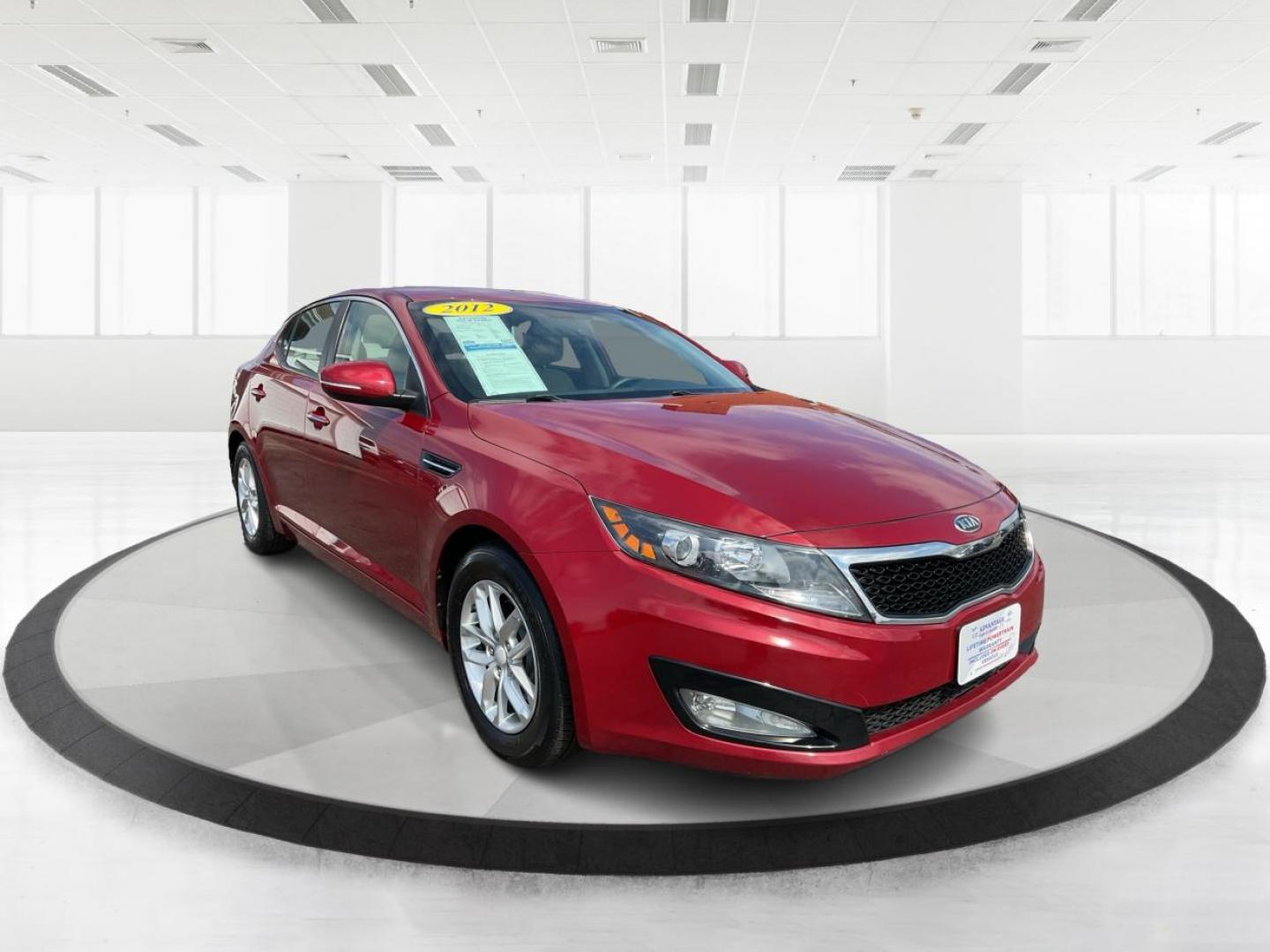 2012 Spicy Red Metallic Kia Optima LX AT (5XXGM4A73CG) with an 2.4L L4 DOHC 16V engine, 6-Speed Automatic transmission, located at 1099 N County Rd 25A, Troy, OH, 45373, (937) 908-9800, 40.057079, -84.212883 - 2012 Kia Optima LX AT - Photo#0