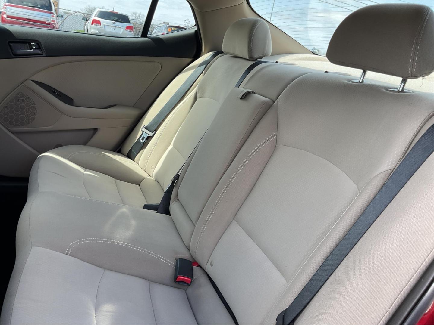 2012 Spicy Red Metallic Kia Optima LX AT (5XXGM4A73CG) with an 2.4L L4 DOHC 16V engine, 6-Speed Automatic transmission, located at 1099 N County Rd 25A, Troy, OH, 45373, (937) 908-9800, 40.057079, -84.212883 - 2012 Kia Optima LX AT - Photo#9