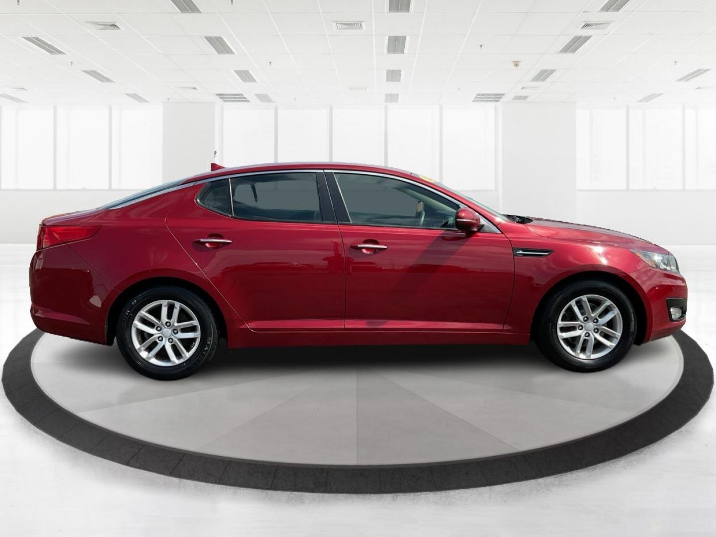 2012 Spicy Red Metallic Kia Optima LX AT (5XXGM4A73CG) with an 2.4L L4 DOHC 16V engine, 6-Speed Automatic transmission, located at 1099 N County Rd 25A, Troy, OH, 45373, (937) 908-9800, 40.057079, -84.212883 - 2012 Kia Optima LX AT - Photo#1