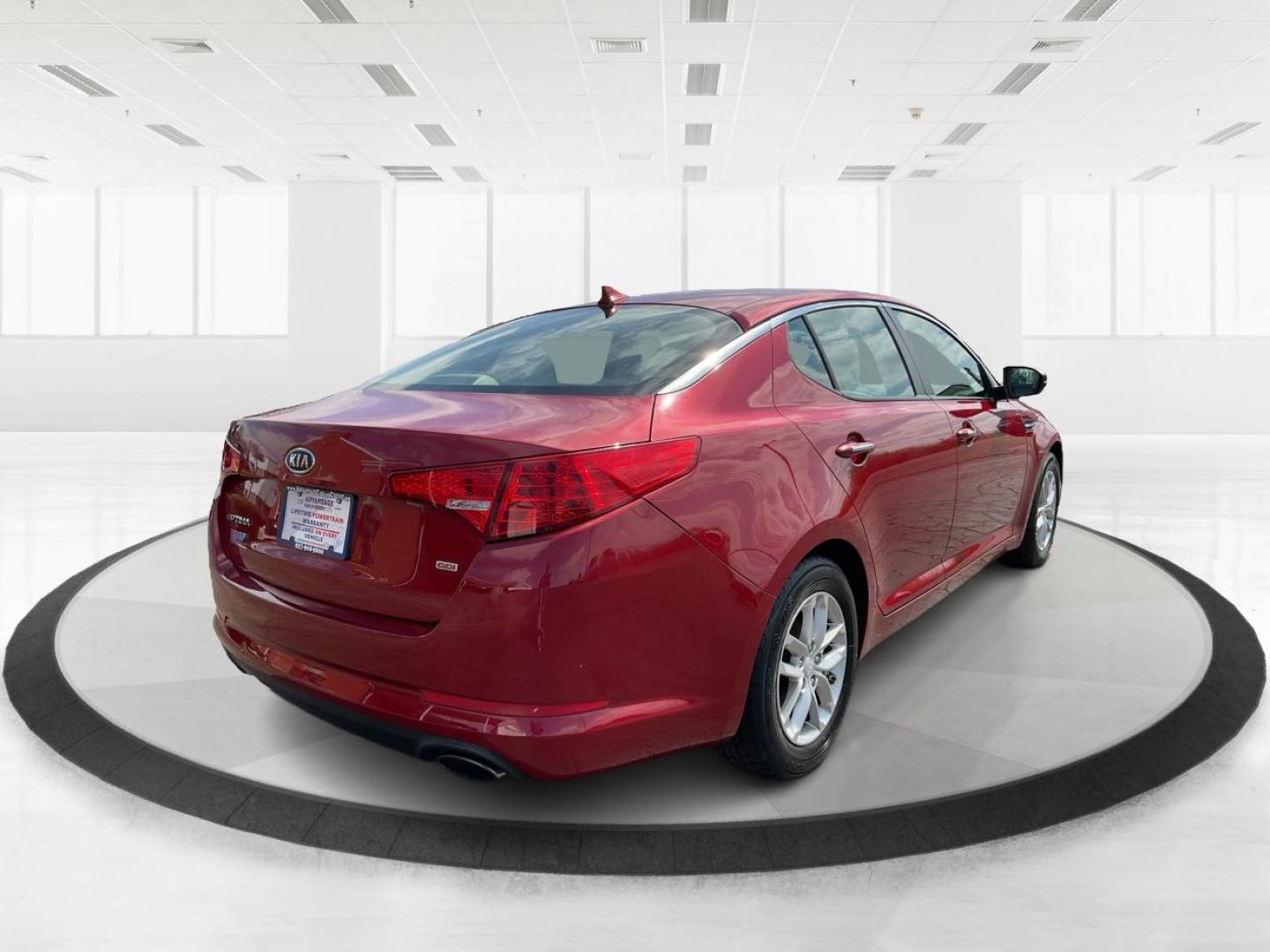 2012 Spicy Red Metallic Kia Optima LX AT (5XXGM4A73CG) with an 2.4L L4 DOHC 16V engine, 6-Speed Automatic transmission, located at 1099 N County Rd 25A, Troy, OH, 45373, (937) 908-9800, 40.057079, -84.212883 - 2012 Kia Optima LX AT - Photo#2