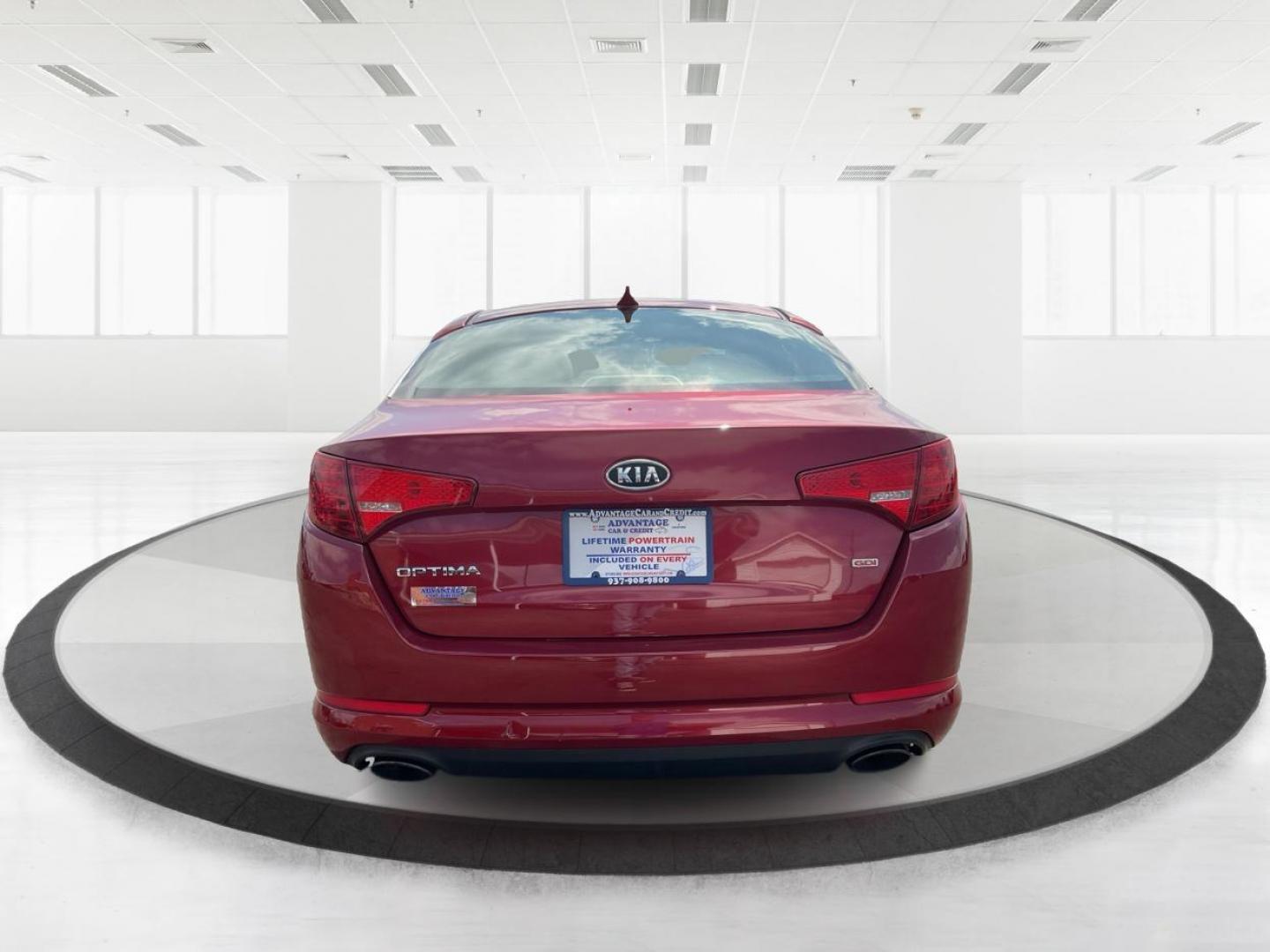 2012 Spicy Red Metallic Kia Optima LX AT (5XXGM4A73CG) with an 2.4L L4 DOHC 16V engine, 6-Speed Automatic transmission, located at 1099 N County Rd 25A, Troy, OH, 45373, (937) 908-9800, 40.057079, -84.212883 - 2012 Kia Optima LX AT - Photo#3