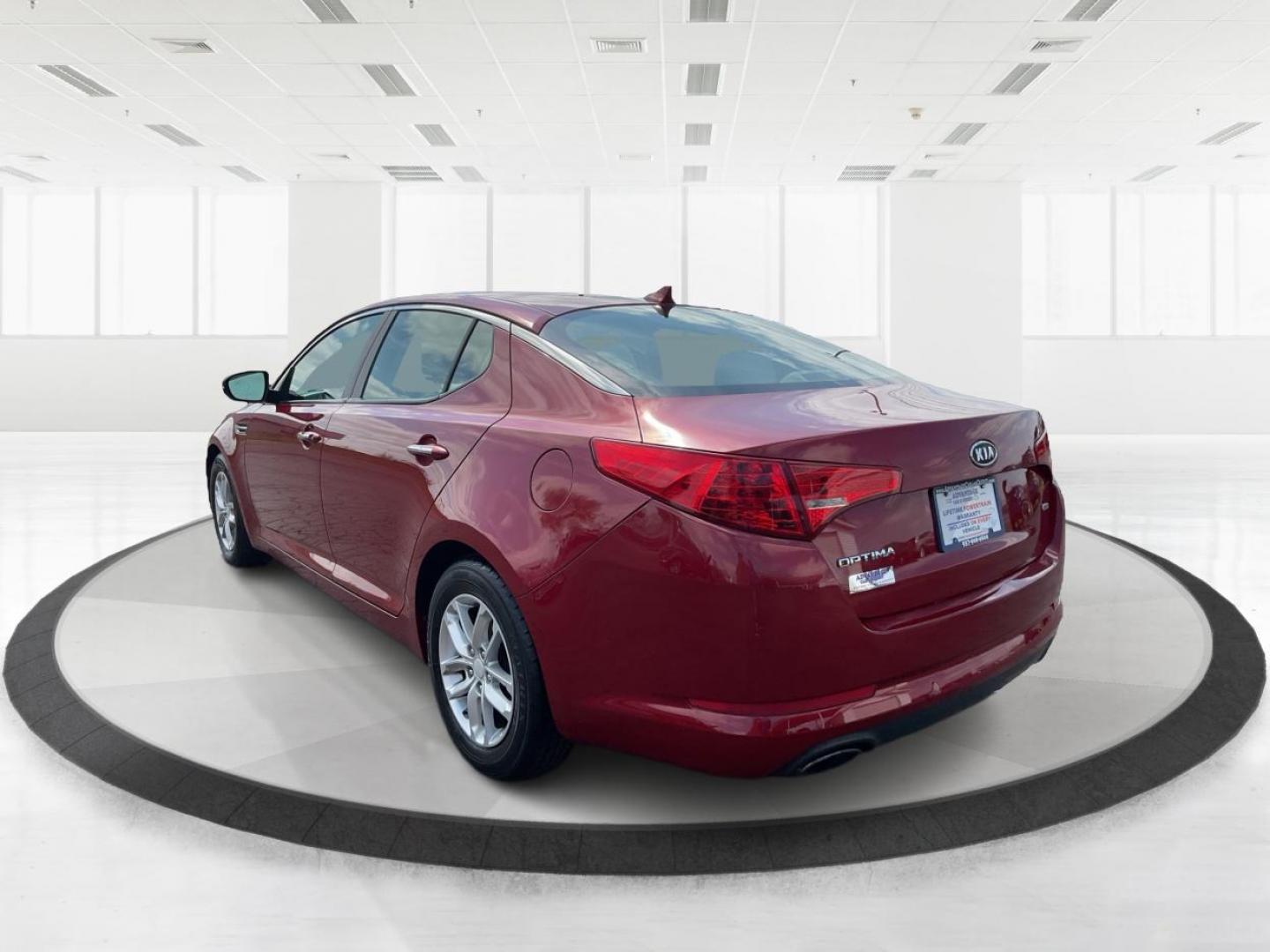 2012 Spicy Red Metallic Kia Optima LX AT (5XXGM4A73CG) with an 2.4L L4 DOHC 16V engine, 6-Speed Automatic transmission, located at 1099 N County Rd 25A, Troy, OH, 45373, (937) 908-9800, 40.057079, -84.212883 - 2012 Kia Optima LX AT - Photo#4