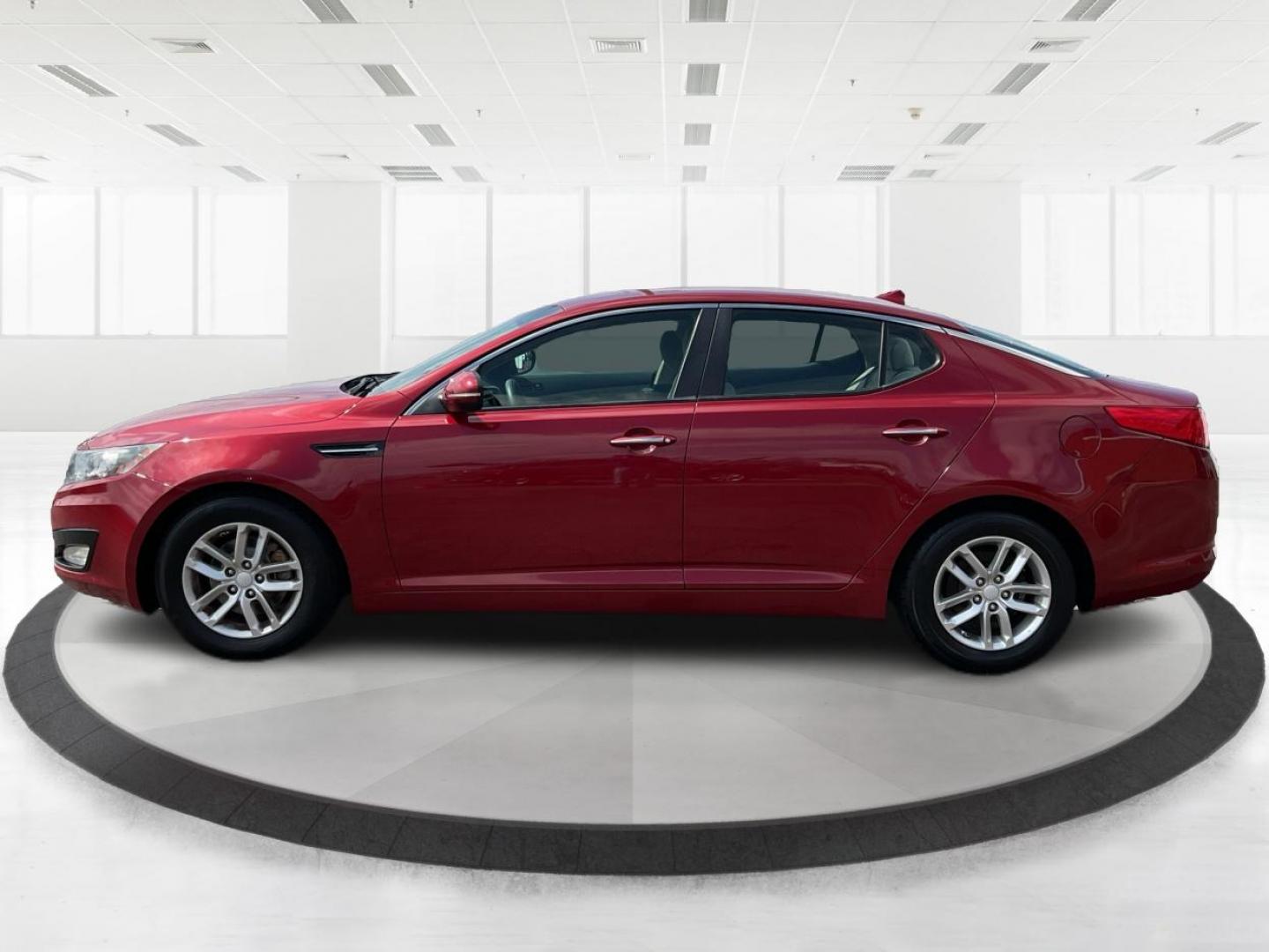 2012 Spicy Red Metallic Kia Optima LX AT (5XXGM4A73CG) with an 2.4L L4 DOHC 16V engine, 6-Speed Automatic transmission, located at 1099 N County Rd 25A, Troy, OH, 45373, (937) 908-9800, 40.057079, -84.212883 - 2012 Kia Optima LX AT - Photo#5