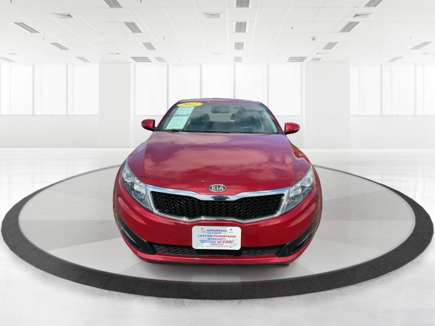 2012 Spicy Red Metallic Kia Optima LX AT (5XXGM4A73CG) with an 2.4L L4 DOHC 16V engine, 6-Speed Automatic transmission, located at 1099 N County Rd 25A, Troy, OH, 45373, (937) 908-9800, 40.057079, -84.212883 - 2012 Kia Optima LX AT - Photo#6