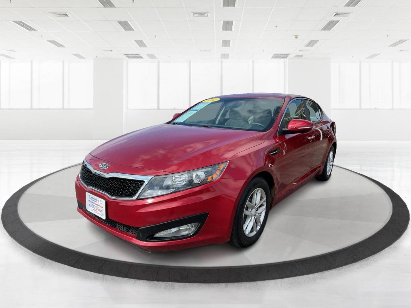 2012 Spicy Red Metallic Kia Optima LX AT (5XXGM4A73CG) with an 2.4L L4 DOHC 16V engine, 6-Speed Automatic transmission, located at 1099 N County Rd 25A, Troy, OH, 45373, (937) 908-9800, 40.057079, -84.212883 - 2012 Kia Optima LX AT - Photo#7