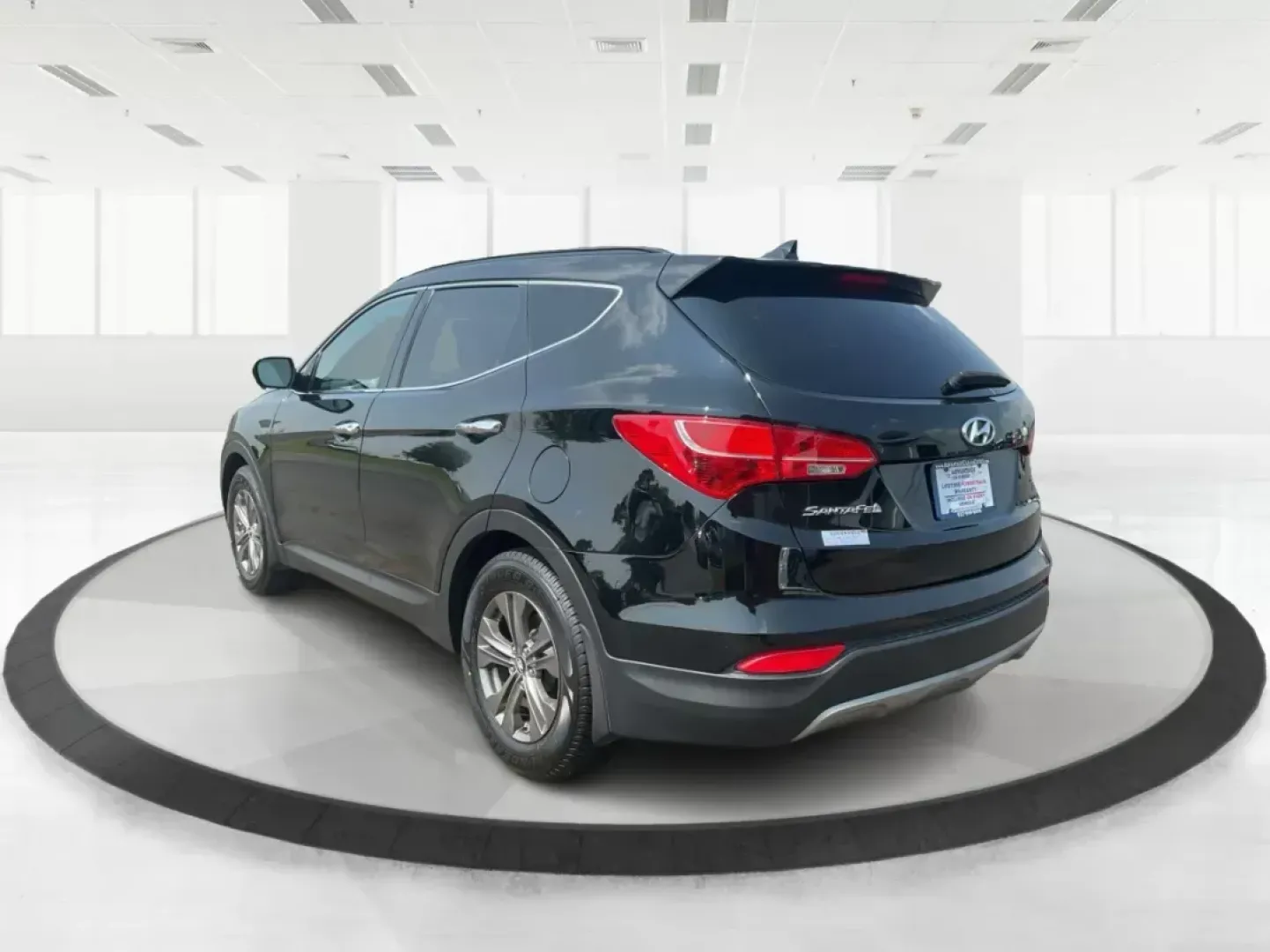 2013 Twilight Black Hyundai Santa Fe Sport 2.4 AWD (5XYZUDLB5DG) with an 2.4L L4 DOHC 16V engine, 6-Speed Automatic transmission, located at 4508 South Dixie Dr, Moraine, OH, 45439, (937) 908-9800, 39.689976, -84.218452 - **Explore Adventure with the 2013 Hyundai Santa Fe Sport in Fairborn, OH!**<br /> <br /> Are you ready to elevate your family adventures or tackle daily commutes with style and reliability? Look no further than the stunning 2013 Hyundai Santa Fe Sport 2.4 AWD, available at Advantage Car and Credit, - Photo#4