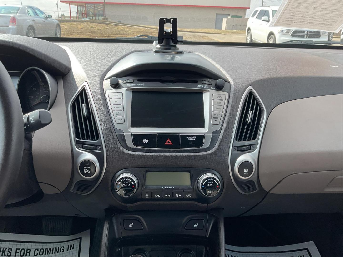2013 Hyundai Tucson Limited (KM8JU3AC4DU) with an Theta II 2.4L I-4 DOHC engine, located at 1099 N County Rd 25A, Troy, OH, 45373, (937) 908-9800, 40.057079, -84.212883 - 2013 Hyundai Tucson Limited - Photo#11