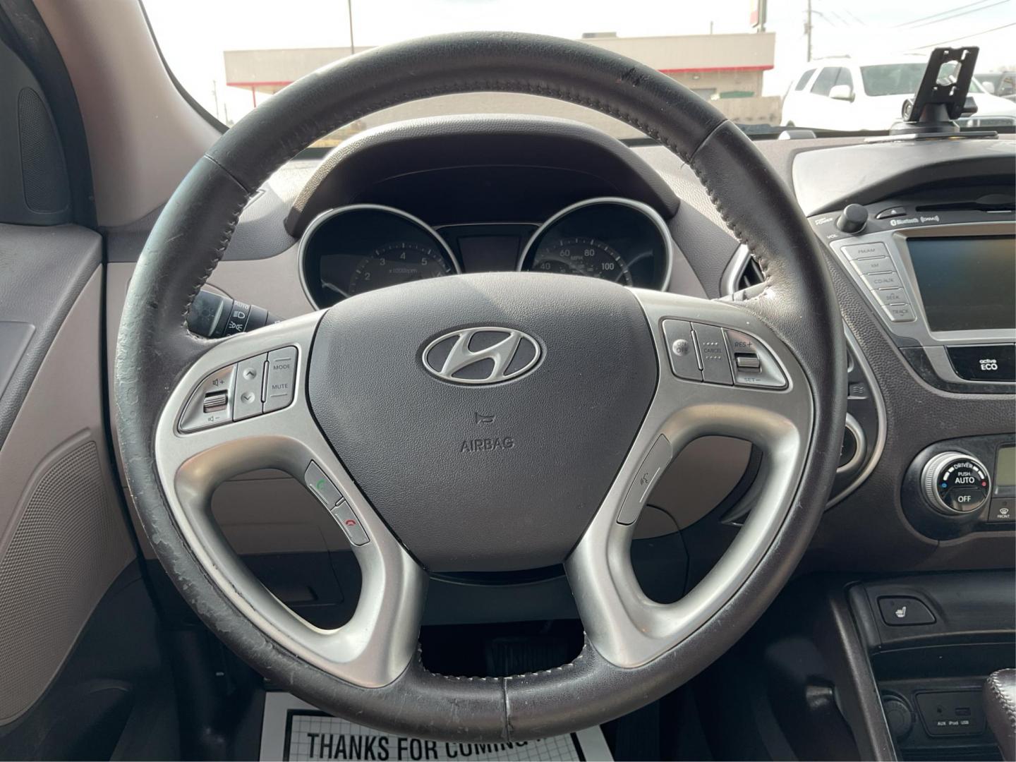 2013 Hyundai Tucson Limited (KM8JU3AC4DU) with an Theta II 2.4L I-4 DOHC engine, located at 1099 N County Rd 25A, Troy, OH, 45373, (937) 908-9800, 40.057079, -84.212883 - 2013 Hyundai Tucson Limited - Photo#14