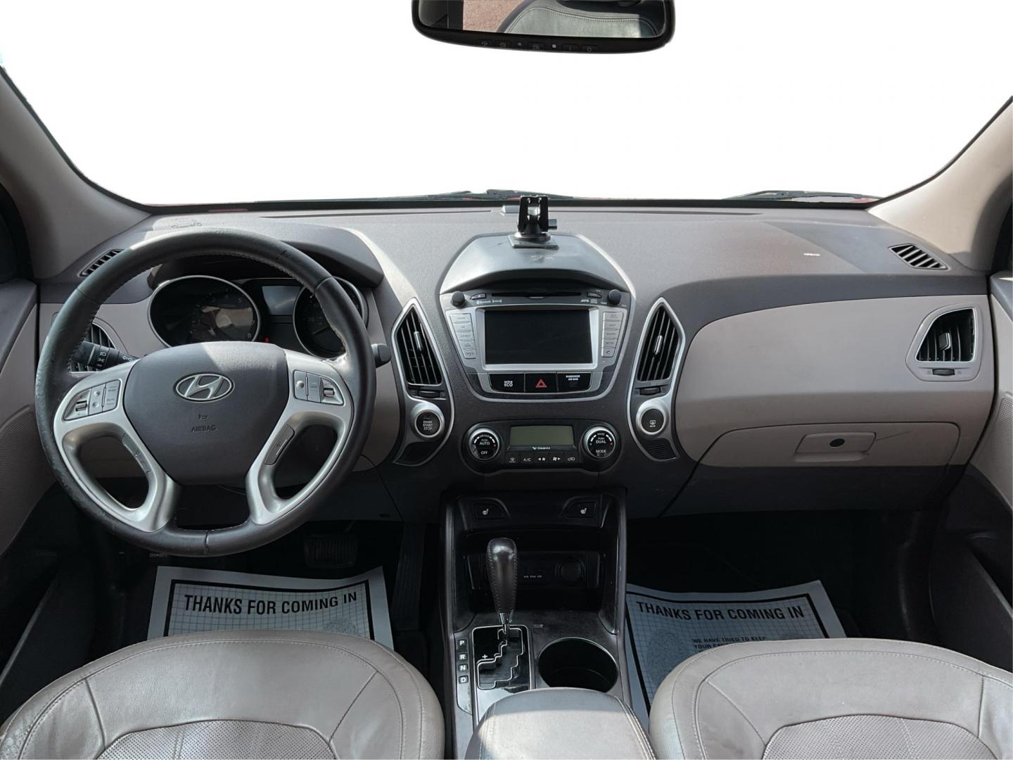 2013 Hyundai Tucson Limited (KM8JU3AC4DU) with an Theta II 2.4L I-4 DOHC engine, located at 1099 N County Rd 25A, Troy, OH, 45373, (937) 908-9800, 40.057079, -84.212883 - 2013 Hyundai Tucson Limited - Photo#18