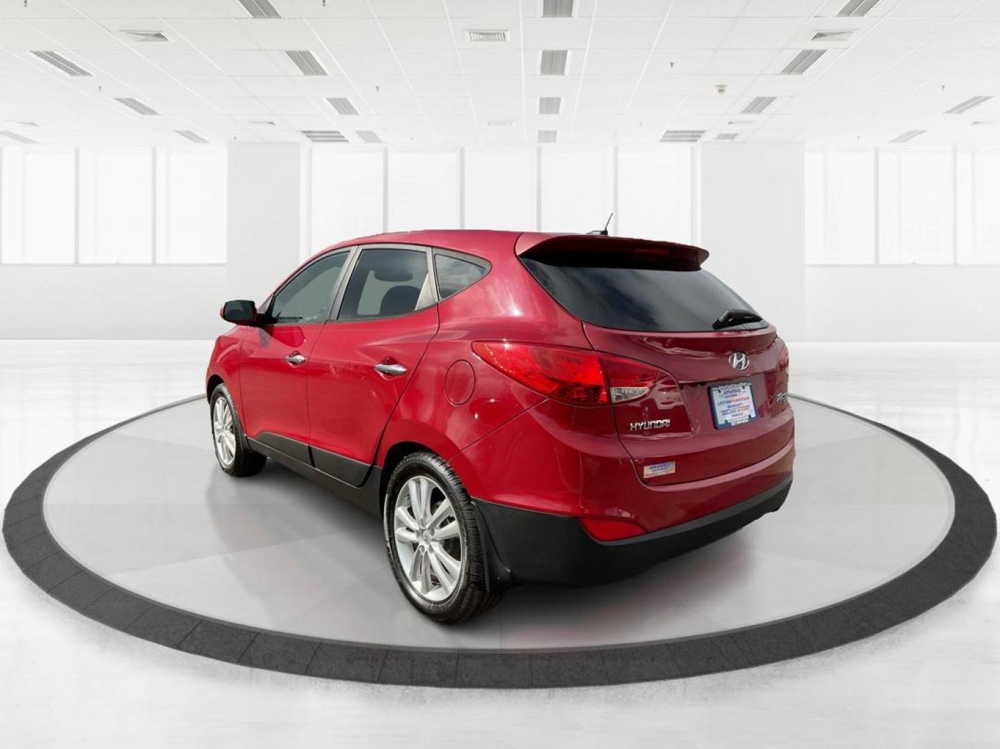 2013 Hyundai Tucson Limited (KM8JU3AC4DU) with an Theta II 2.4L I-4 DOHC engine, located at 1099 N County Rd 25A, Troy, OH, 45373, (937) 908-9800, 40.057079, -84.212883 - 2013 Hyundai Tucson Limited - Photo#3