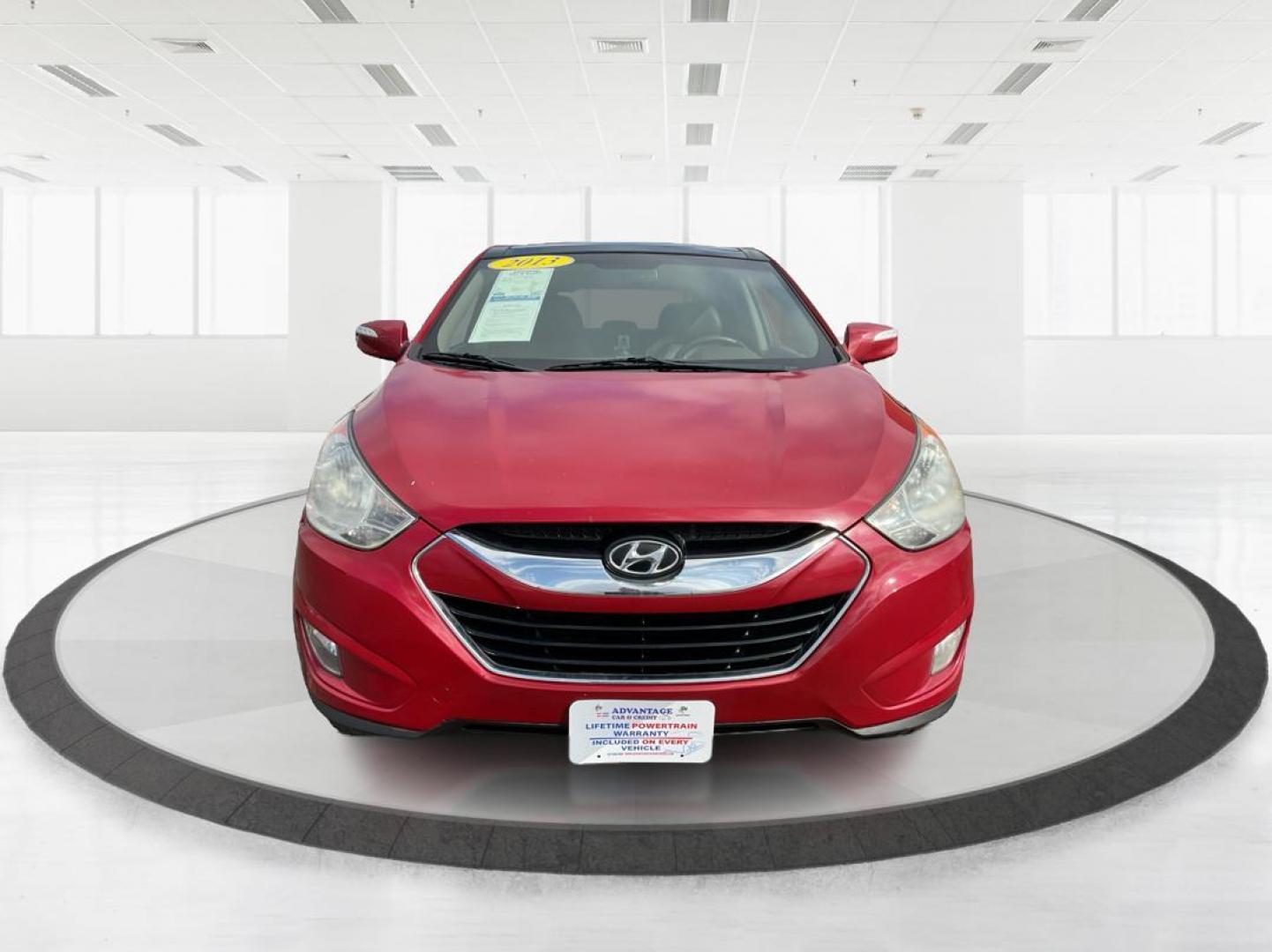 2013 Hyundai Tucson Limited (KM8JU3AC4DU) with an Theta II 2.4L I-4 DOHC engine, located at 1099 N County Rd 25A, Troy, OH, 45373, (937) 908-9800, 40.057079, -84.212883 - 2013 Hyundai Tucson Limited - Photo#5