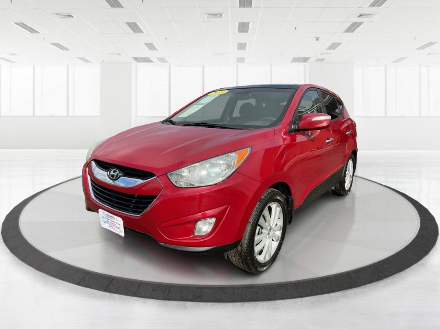 2013 Hyundai Tucson Limited (KM8JU3AC4DU) with an Theta II 2.4L I-4 DOHC engine, located at 1099 N County Rd 25A, Troy, OH, 45373, (937) 908-9800, 40.057079, -84.212883 - 2013 Hyundai Tucson Limited - Photo#6