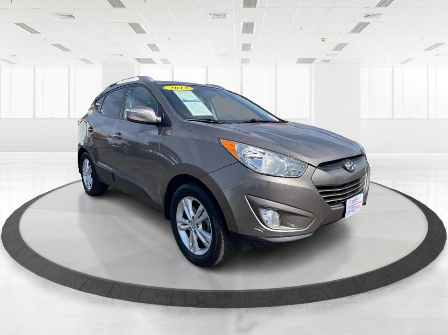 2013 Hyundai Tucson GLS (KM8JU3AC1DU) with an Theta II 2.4L I-4 DOHC engine, located at 1099 N County Rd 25A, Troy, OH, 45373, (937) 908-9800, 40.057079, -84.212883 - 2013 Hyundai Tucson GLS - Photo#0