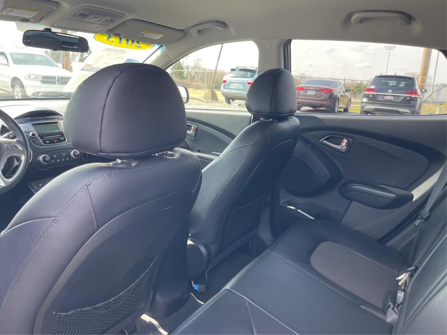 2013 Hyundai Tucson GLS (KM8JU3AC1DU) with an Theta II 2.4L I-4 DOHC engine, located at 1099 N County Rd 25A, Troy, OH, 45373, (937) 908-9800, 40.057079, -84.212883 - 2013 Hyundai Tucson GLS - Photo#9