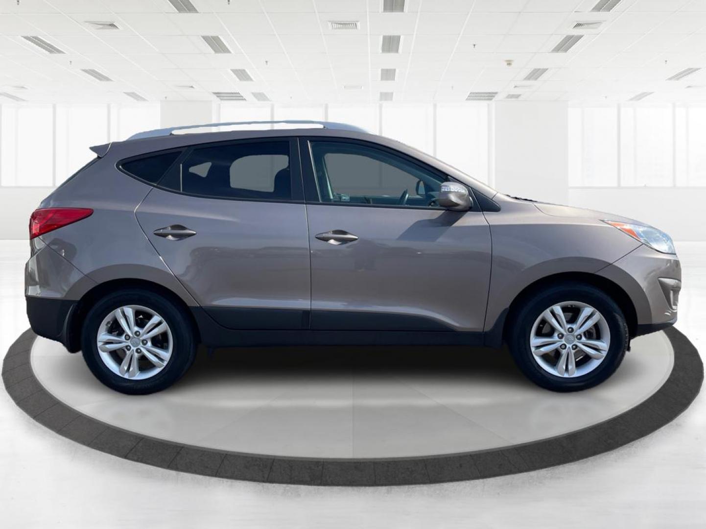 2013 Hyundai Tucson GLS (KM8JU3AC1DU) with an Theta II 2.4L I-4 DOHC engine, located at 1099 N County Rd 25A, Troy, OH, 45373, (937) 908-9800, 40.057079, -84.212883 - 2013 Hyundai Tucson GLS - Photo#1