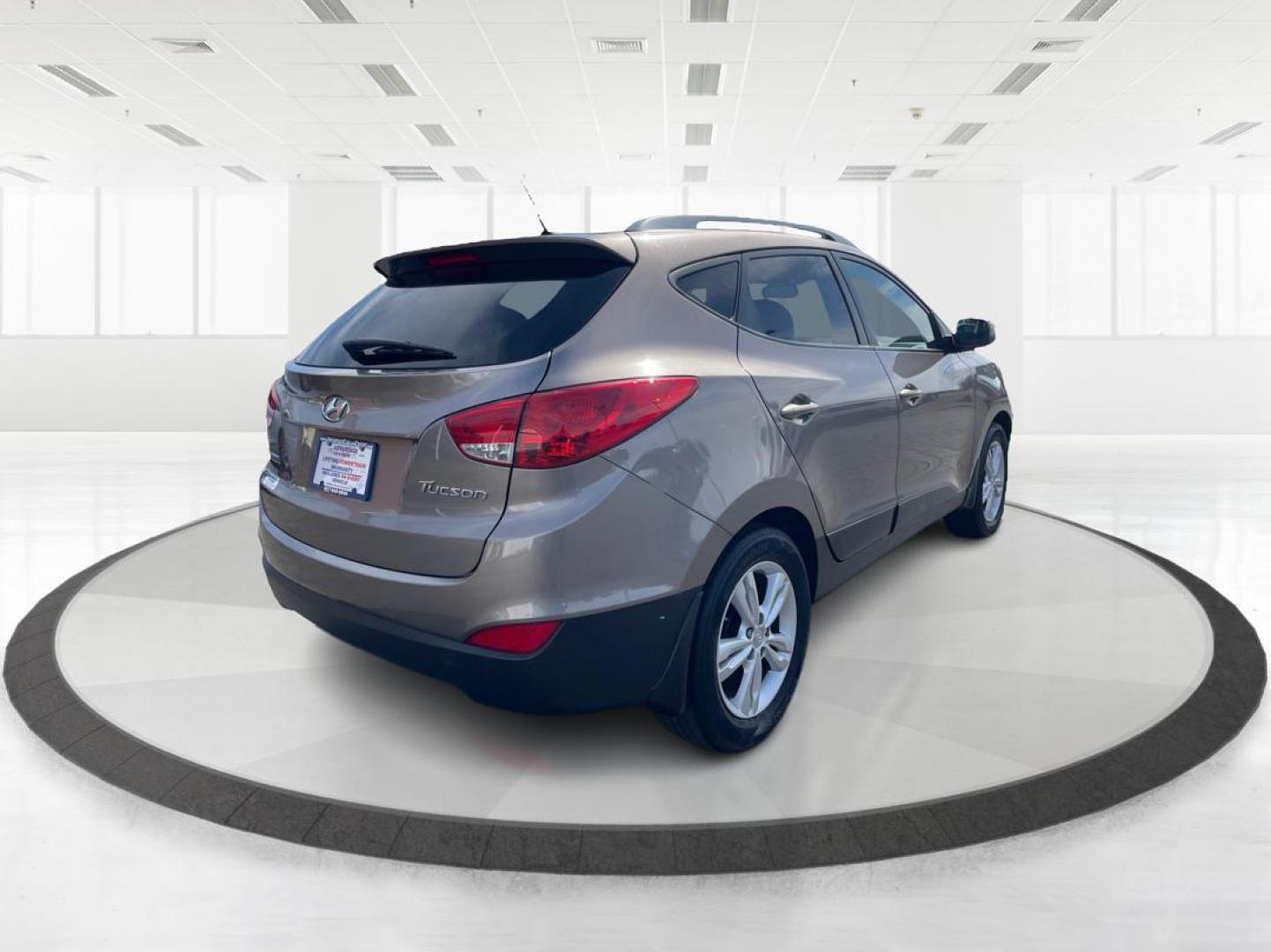 2013 Hyundai Tucson GLS (KM8JU3AC1DU) with an Theta II 2.4L I-4 DOHC engine, located at 1099 N County Rd 25A, Troy, OH, 45373, (937) 908-9800, 40.057079, -84.212883 - 2013 Hyundai Tucson GLS - Photo#2