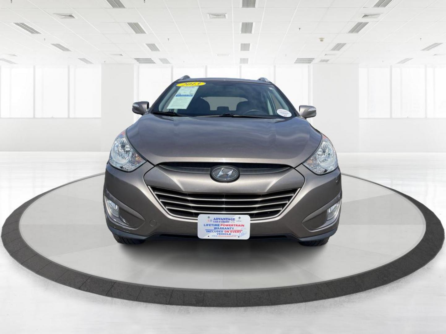 2013 Hyundai Tucson GLS (KM8JU3AC1DU) with an Theta II 2.4L I-4 DOHC engine, located at 1099 N County Rd 25A, Troy, OH, 45373, (937) 908-9800, 40.057079, -84.212883 - 2013 Hyundai Tucson GLS - Photo#6