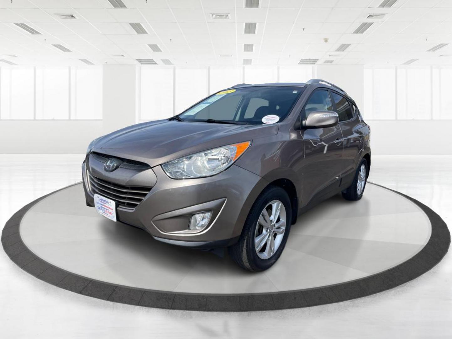 2013 Hyundai Tucson GLS (KM8JU3AC1DU) with an Theta II 2.4L I-4 DOHC engine, located at 1099 N County Rd 25A, Troy, OH, 45373, (937) 908-9800, 40.057079, -84.212883 - 2013 Hyundai Tucson GLS - Photo#7