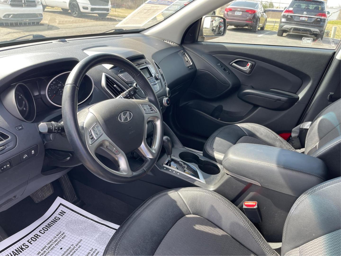 2013 Hyundai Tucson GLS (KM8JU3AC1DU) with an Theta II 2.4L I-4 DOHC engine, located at 1099 N County Rd 25A, Troy, OH, 45373, (937) 908-9800, 40.057079, -84.212883 - 2013 Hyundai Tucson GLS - Photo#8