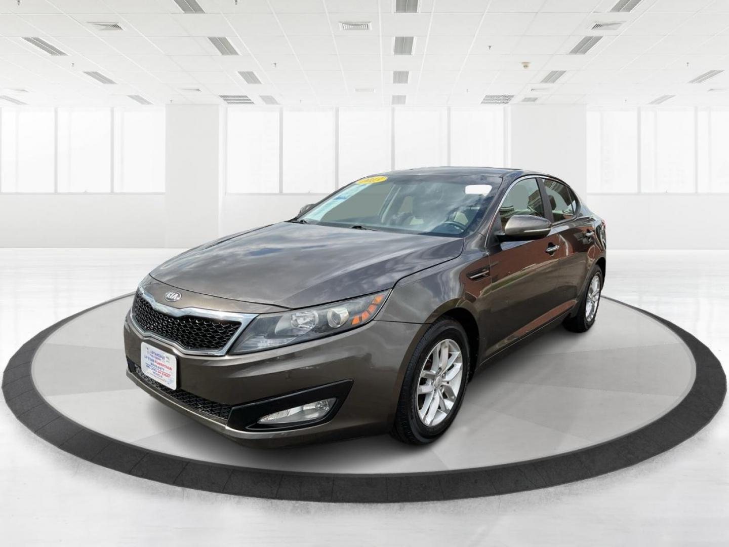 2013 Kia Optima LX (5XXGM4A71DG) with an 2.4L I-4 gasoline direct injection engine, located at 880 E. National Road, Vandalia, OH, 45377, (937) 908-9800, 39.891918, -84.183594 - 2013 Kia Optima LX - Photo#7