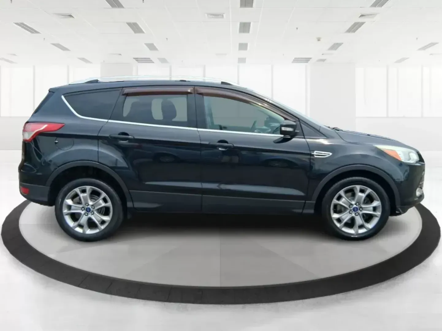 2014 Ford Escape Titanium (1FMCU9J96EU) with an EcoBoost 1.6L I-4 gasoline direct injection engine, located at 4508 South Dixie Dr, Moraine, OH, 45439, (937) 908-9800, 39.689976, -84.218452 - **Unleash Adventure with the 2014 Ford Escape Titanium: Your Ideal Family SUV!**<br /> <br /> Are you ready to take on the open road for your next family getaway or weekend adventure? Look no further than the 2014 Ford Escape Titanium, a versatile SUV that combines style, comfort, and functionality, - Photo#1
