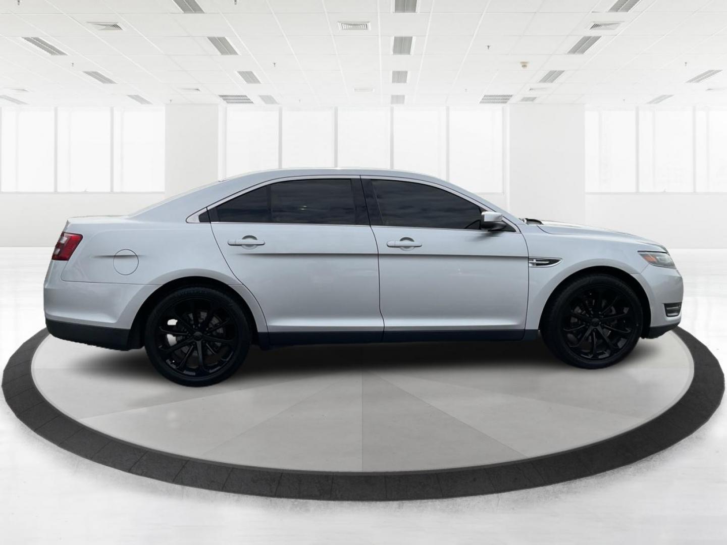 2014 Ford Taurus SEL (1FAHP2E86EG) with an EcoBoost 2L I-4 gasoline direct injection engine, located at 1099 N County Rd 25A, Troy, OH, 45373, (937) 908-9800, 40.057079, -84.212883 - 2014 Ford Taurus SEL - Photo#1