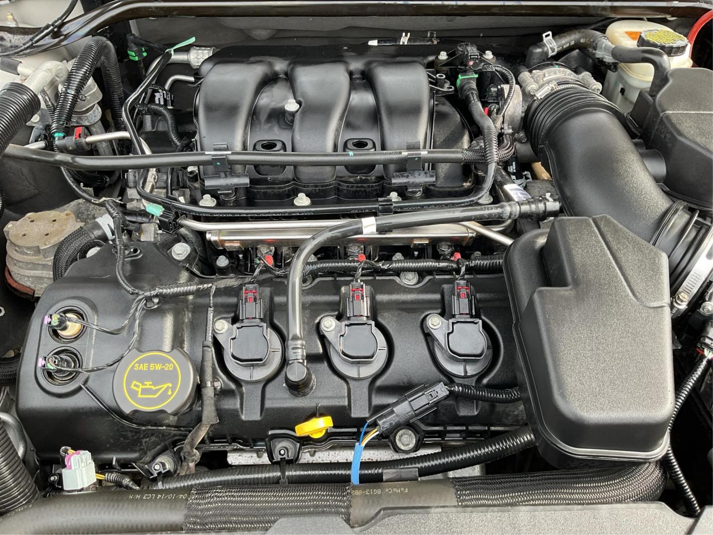 2014 Ford Taurus SEL (1FAHP2E86EG) with an EcoBoost 2L I-4 gasoline direct injection engine, located at 1099 N County Rd 25A, Troy, OH, 45373, (937) 908-9800, 40.057079, -84.212883 - 2014 Ford Taurus SEL - Photo#11