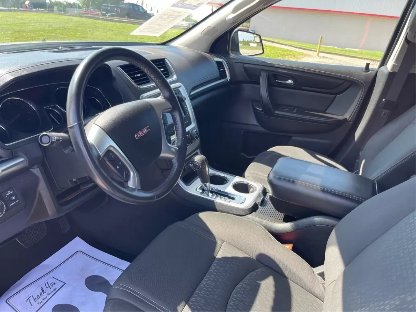 2014 GMC Acadia SLE-2 AWD (1GKKVPKD1EJ) with an 3.6L V6 DOHC 24V engine, 6-Speed Automatic transmission, located at 1099 N County Rd 25A, Troy, OH, 45373, (937) 908-9800, 40.057079, -84.212883 - If you're searching for the perfect family SUV that balances style, comfort, and an adventurous spirit, look no further than this stunning 2014 GMC Acadia SLE-2 AWD, now available at Advantage Car and Credit in Fairborn, OH. With spacious seating for up to eight passengers and the versatility needed - Photo#8