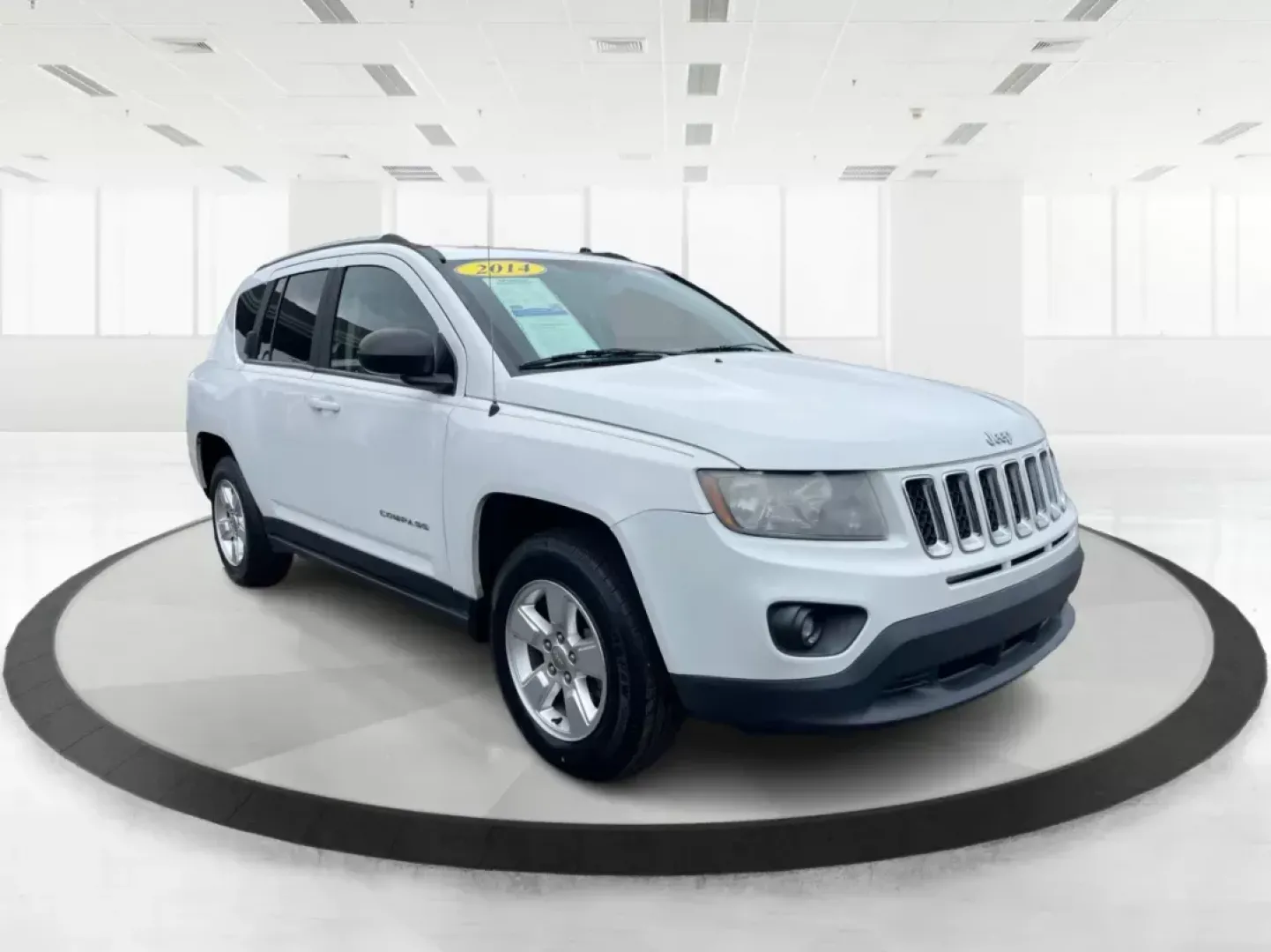 2014 Bright White Clearcoat Jeep Compass Sport FWD (1C4NJCBA9ED) with an 2.0L L4 DOHC 16V engine, located at 880 E. National Road, Vandalia, OH, 45377, (937) 908-9800, 39.891918, -84.183594 - 2014 Jeep Compass Sport FWD - Photo#0